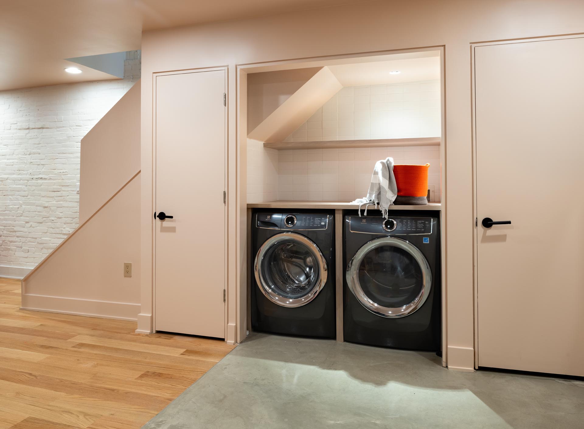 A new laundry area in a former closet in the basement.