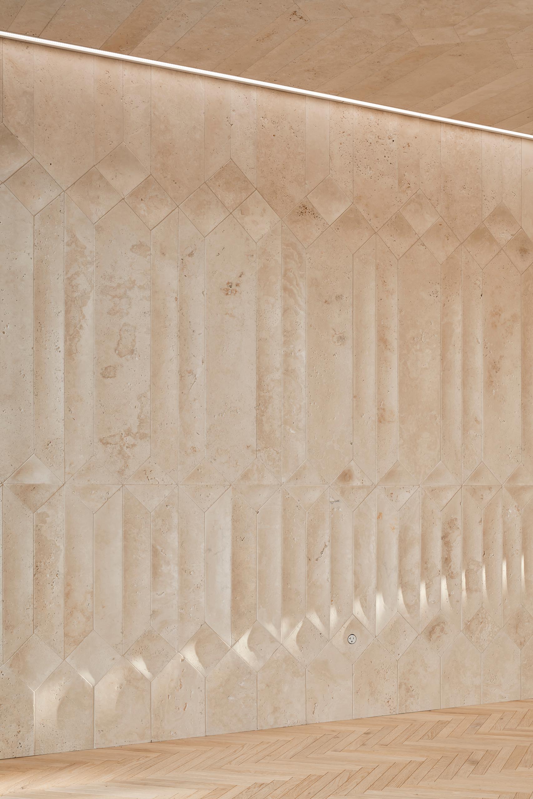 Custom designed travertine walls create unique shadows inside a coffee shop.