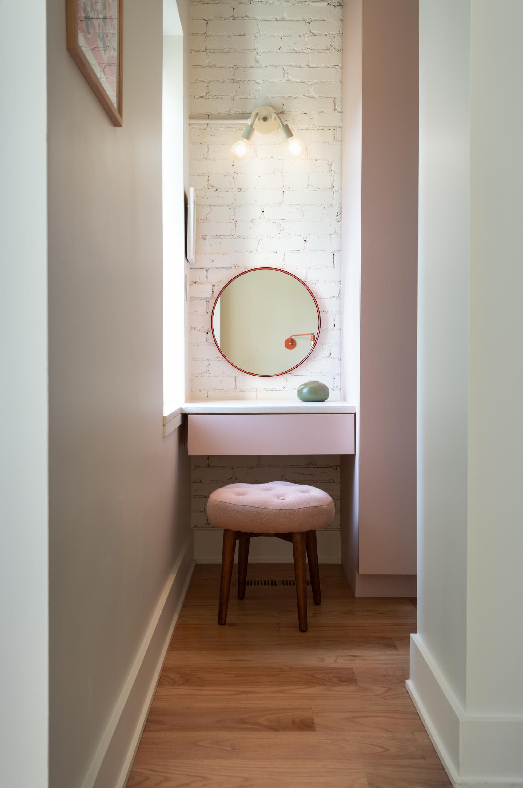 A custom concrete-counter dressing area that seamlessly bleeds into the windowsill for extra surface area.