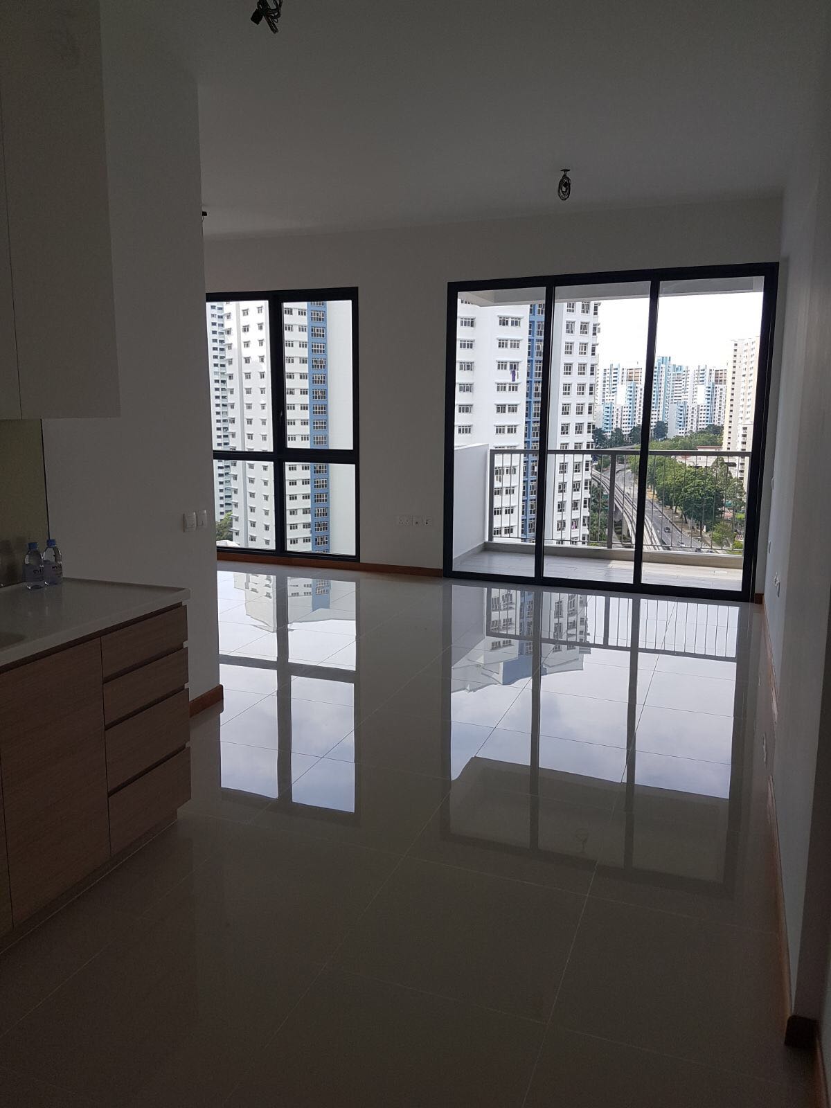 The interior of an empty apartment before a custom loft bed with storage was created.