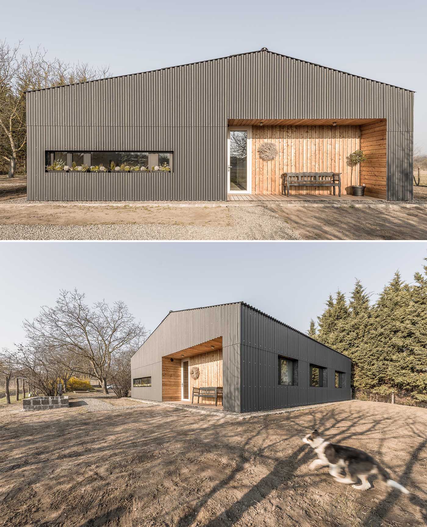 A modern house with corrugated fibre-cement slate siding and alcoves lined with larch wood siding.