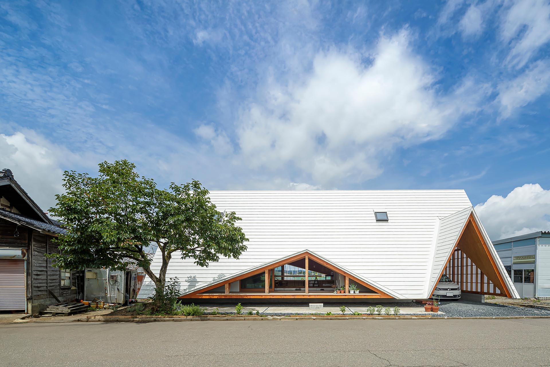 Takeru Shoji Architects Co. has recently completed a new A-frame home in Niigata, Japan, that draws inspiration from the many vinyl greenhouses and work sheds in the surrounding area.