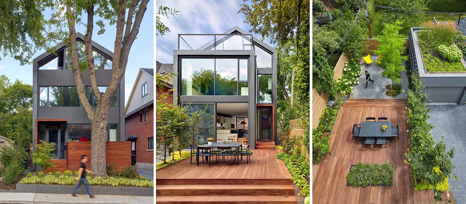 A modern house with walls of glass, a green roof, private outdoor spaces, and wood accents.