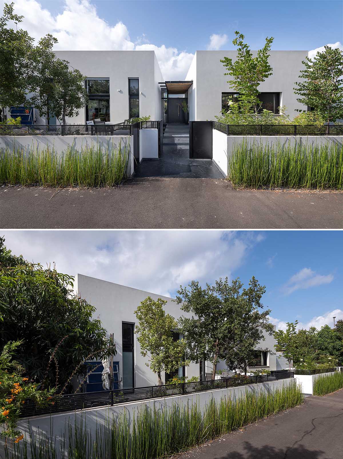 At the front of this modern home, there's a low wall that creates a front yard. Included in the front yard is an additional outdoor lounge and dining area.