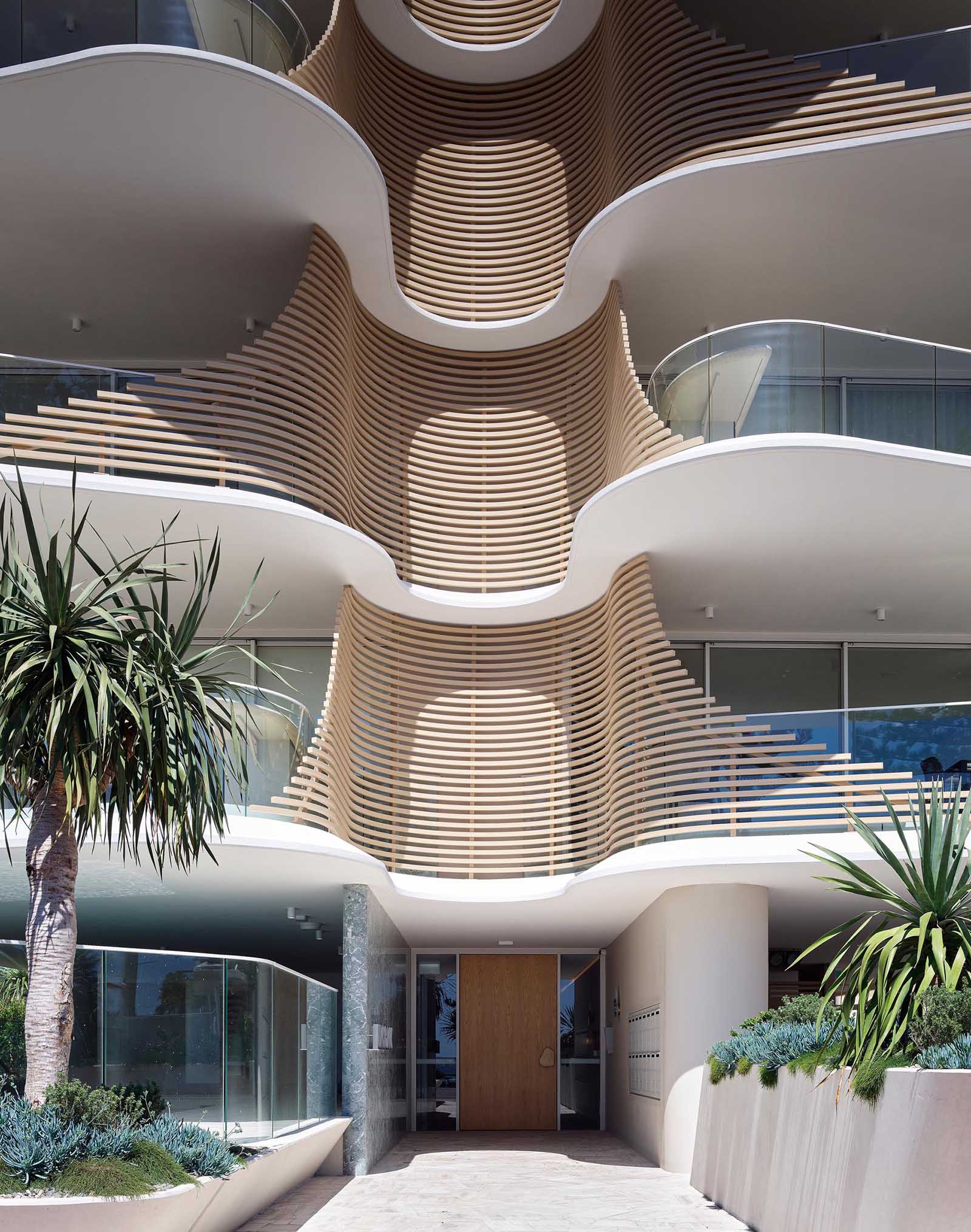 This sculptural and eye-catching building has organic, overlapping architectural curves that resemble the nearby heritage-listed Norfolk Pine Trees.
