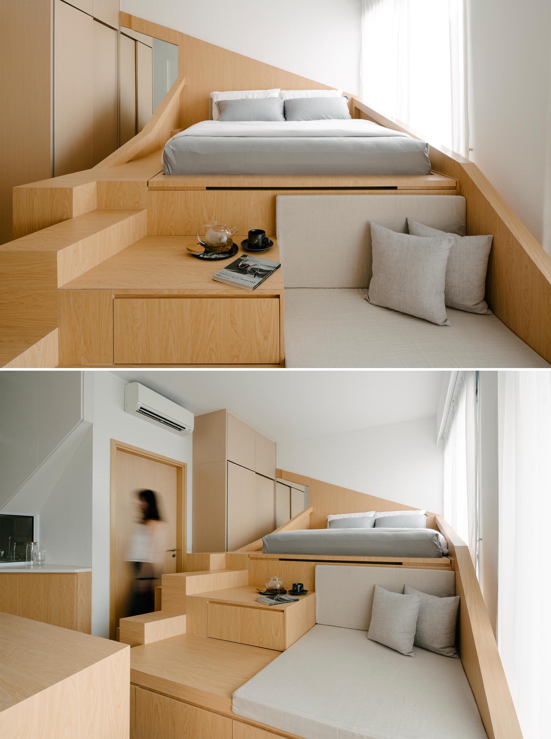 A custom design loft bed with a sofa and storage, has integrated steps up to the bed.
