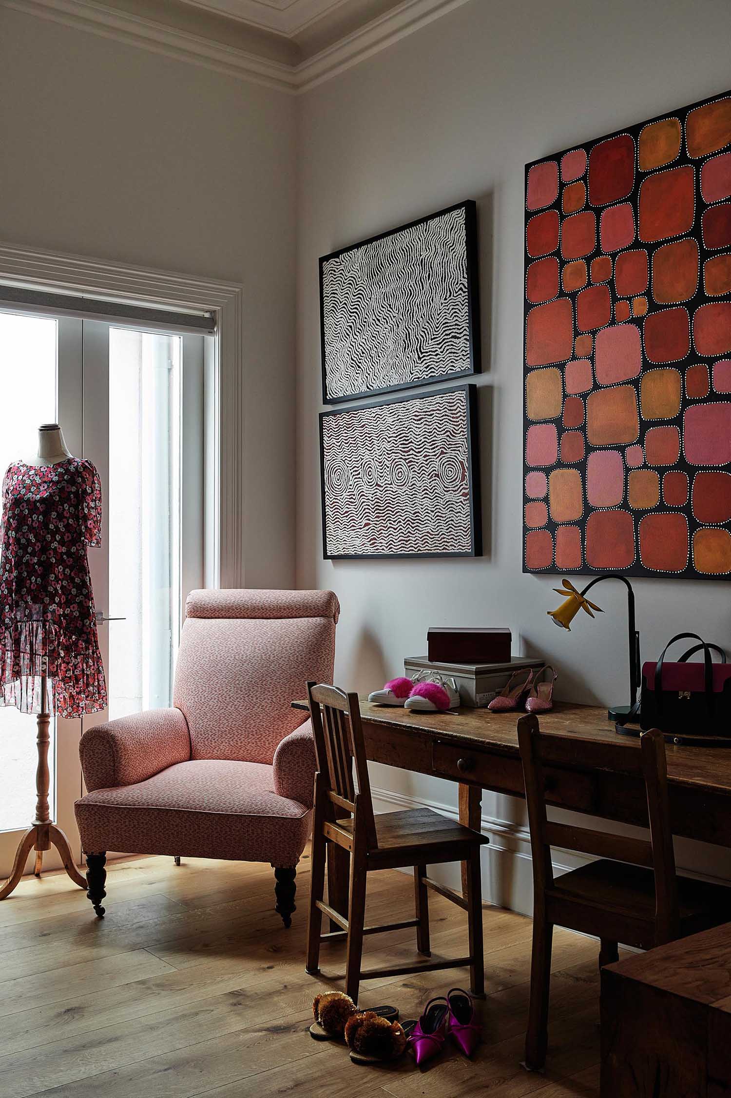 A home office with pink accents.