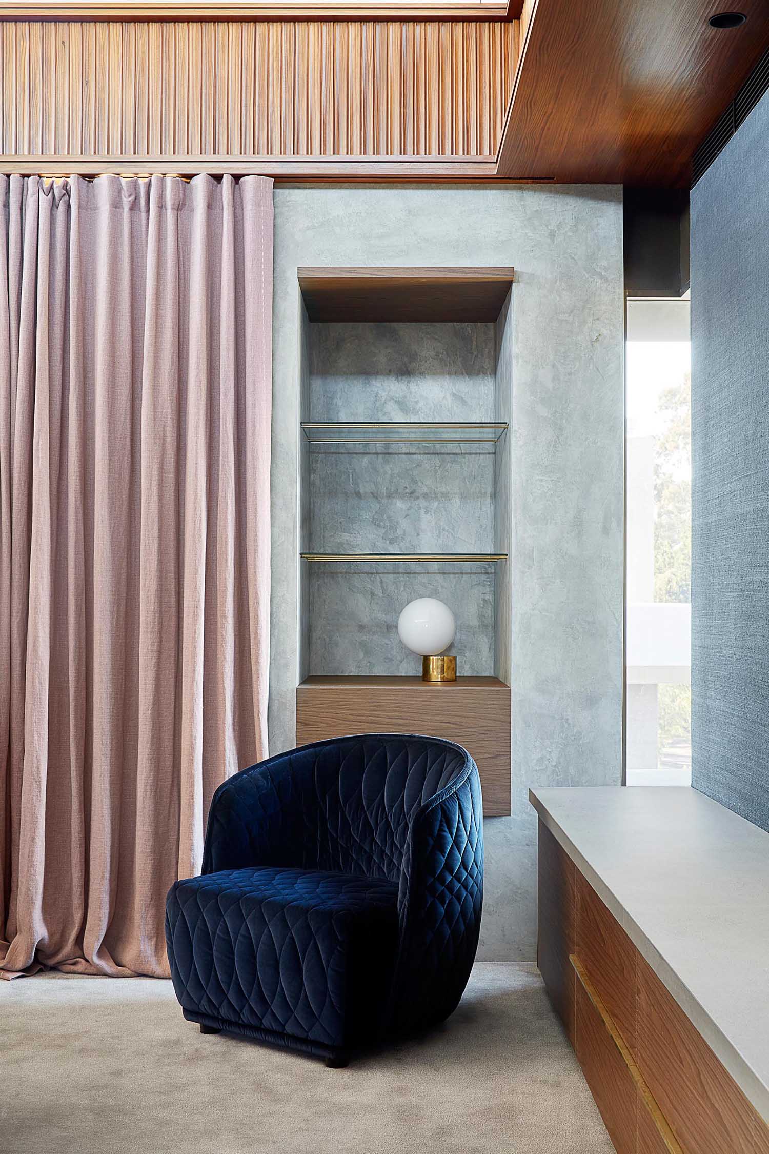 A modern master bedroom with built-in shelving.