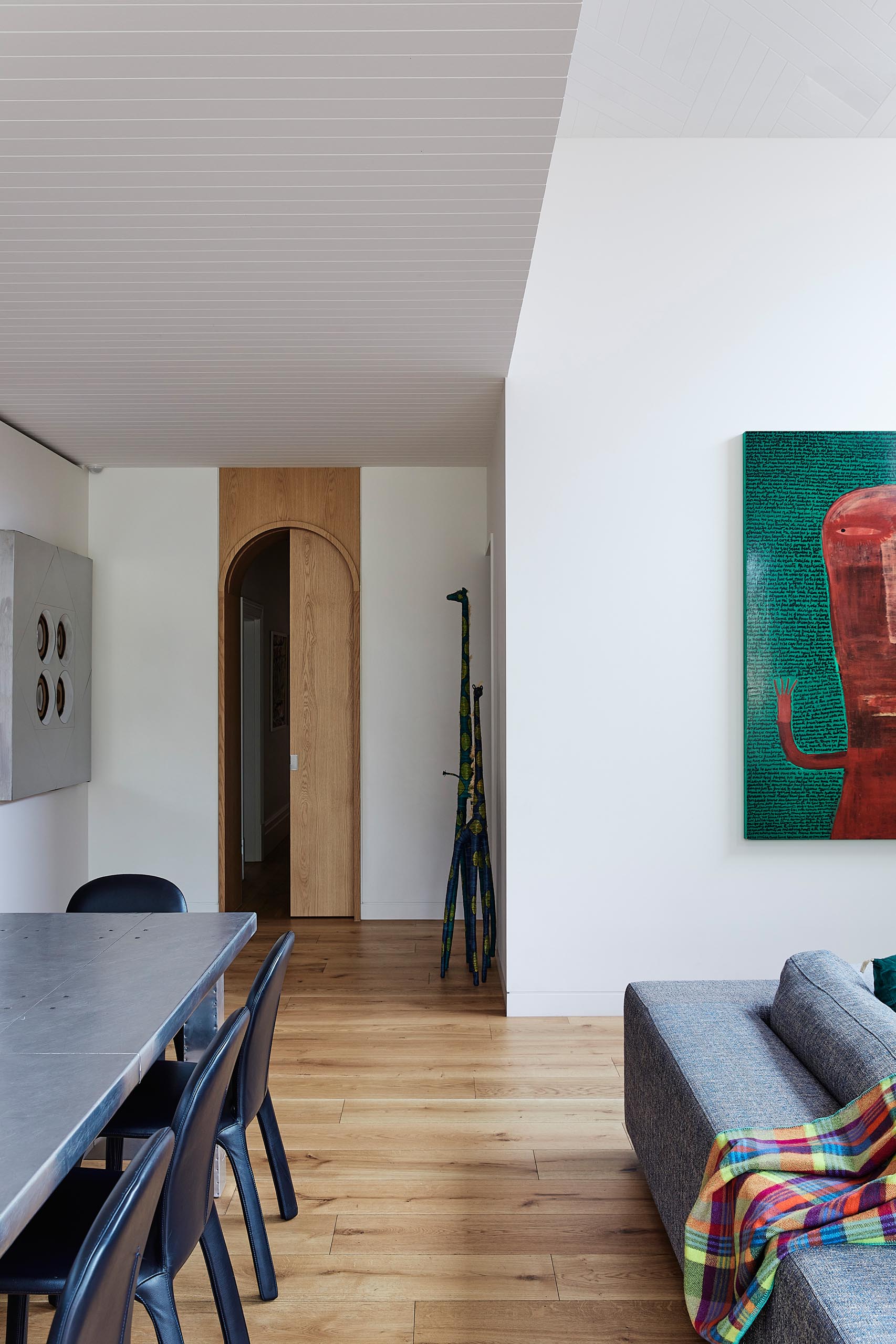 A modern home interior with wood floors and white walls.