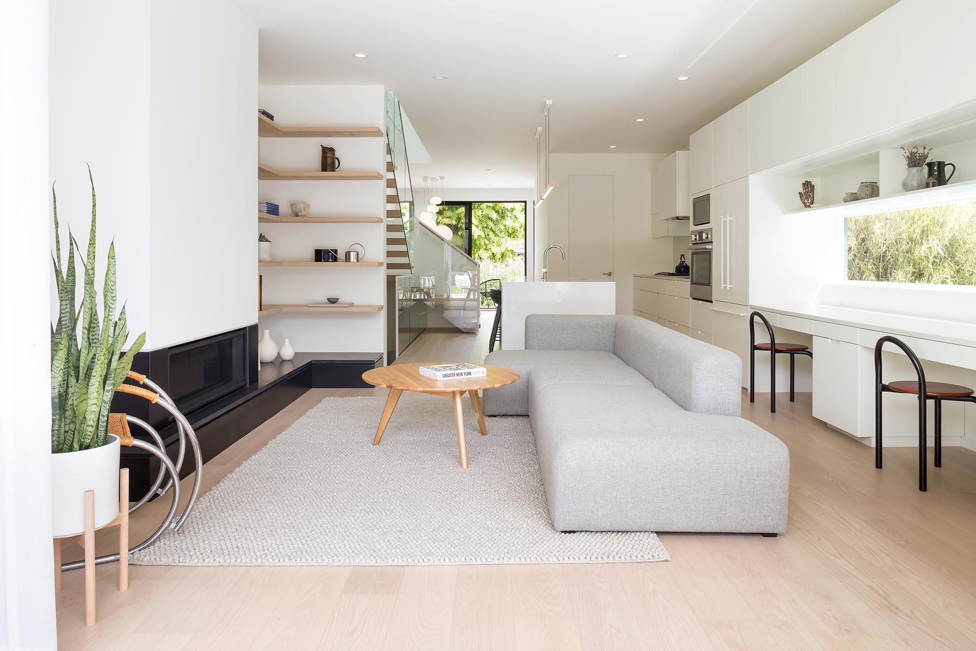 The main social areas of this modern home are all open plan, with a built-in children’s study area adjacent the kitchen.