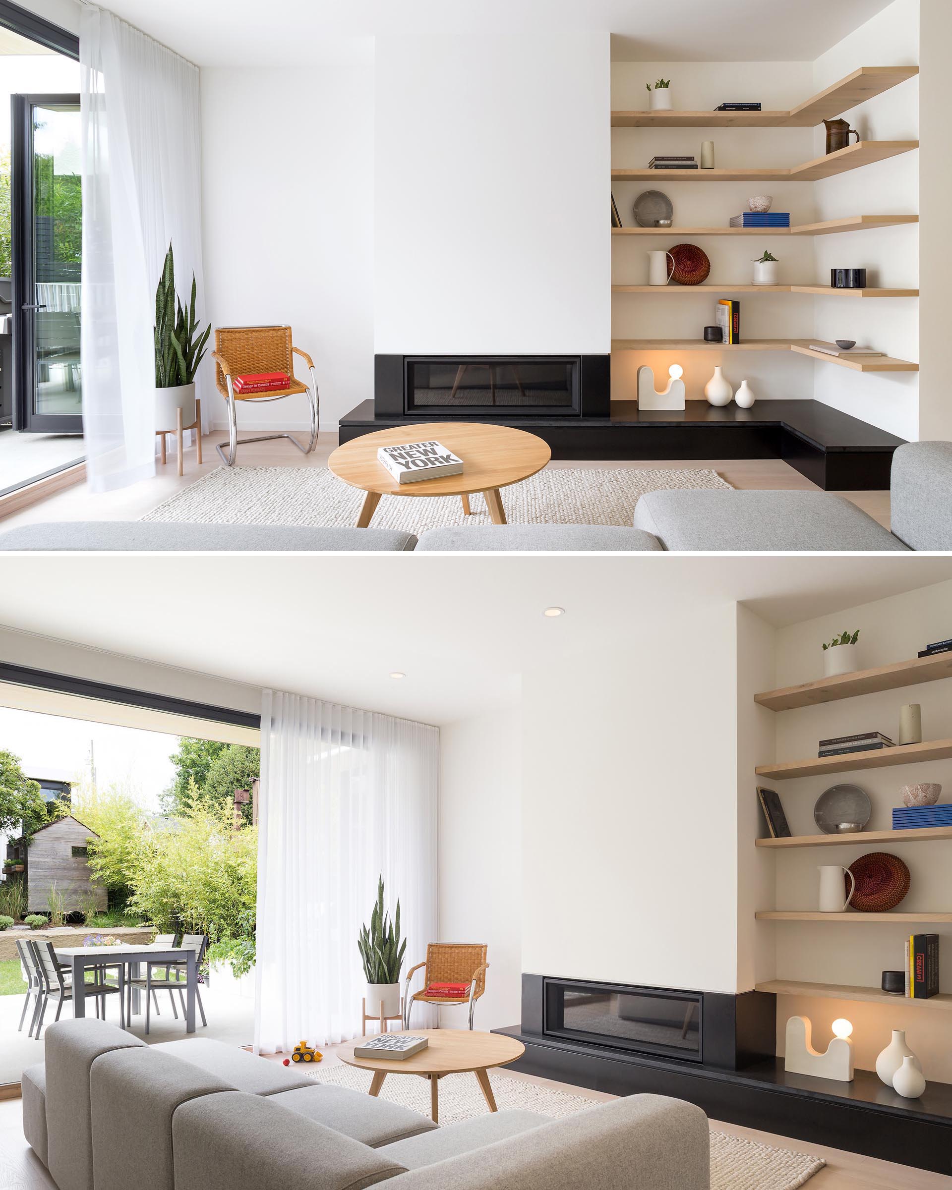 This modern family room includes a gas fireplace and wood shelving that lines the corner, opens fully level to the rear yard.