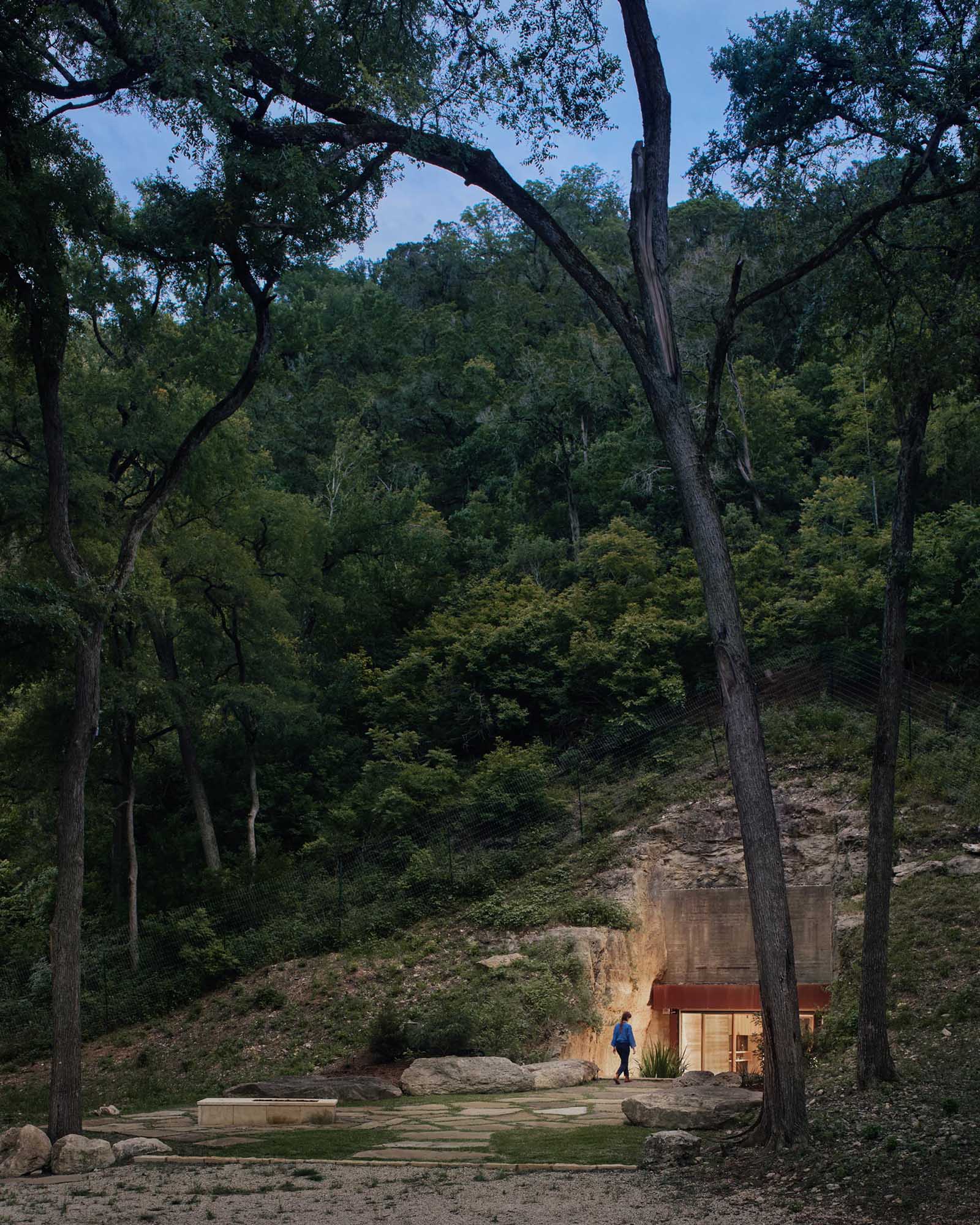 A private wine cave includes a tasting lounge, bar, wine cellar, and restroom.