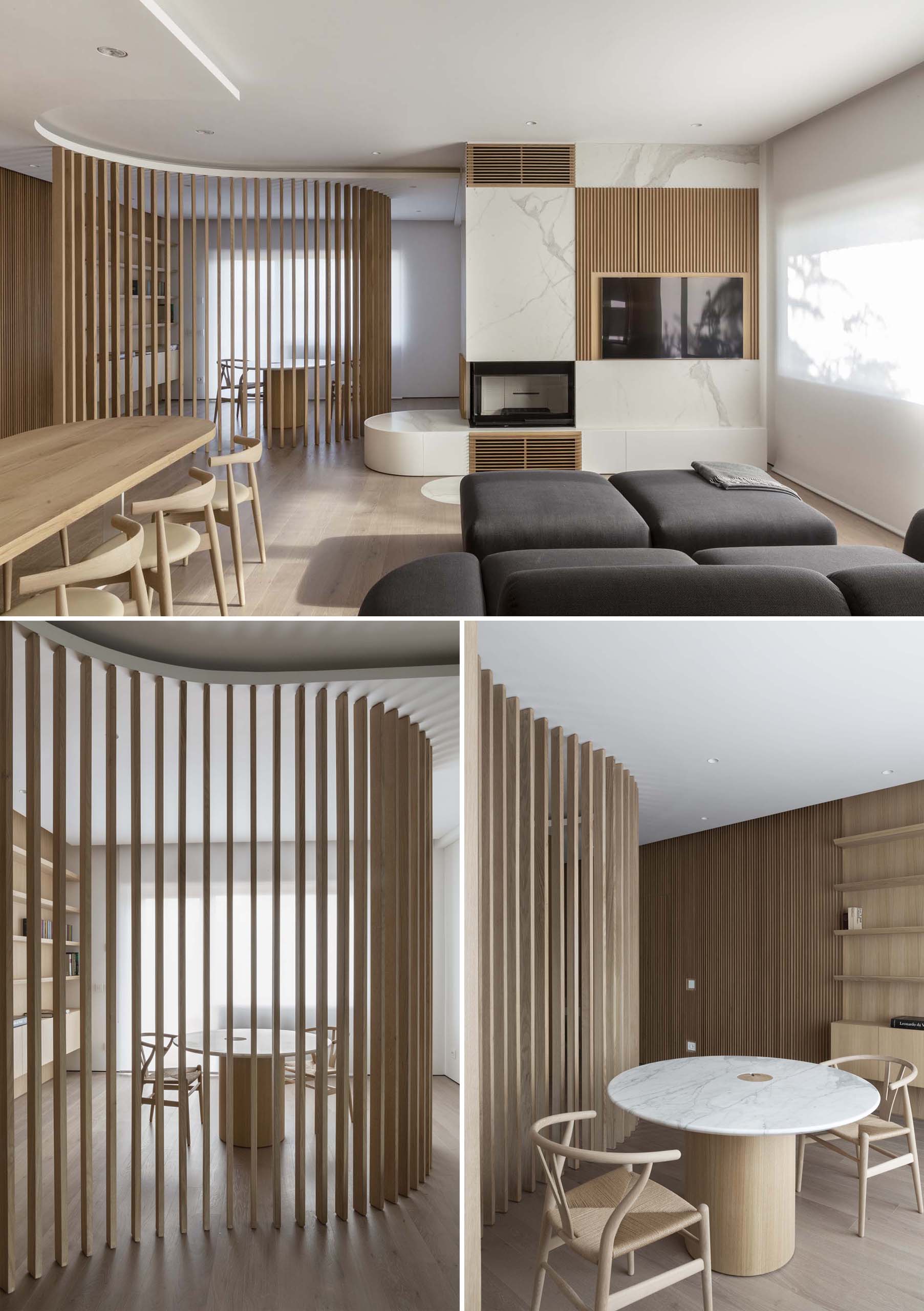 A curved oak slat partition wall separates the study from the living room in this modern apartment interior.