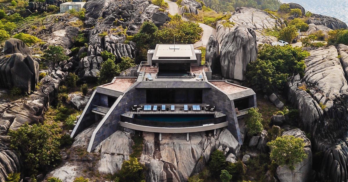 A Collection Of Modern Homes Are Built Into These Weathered Granite Cliffs