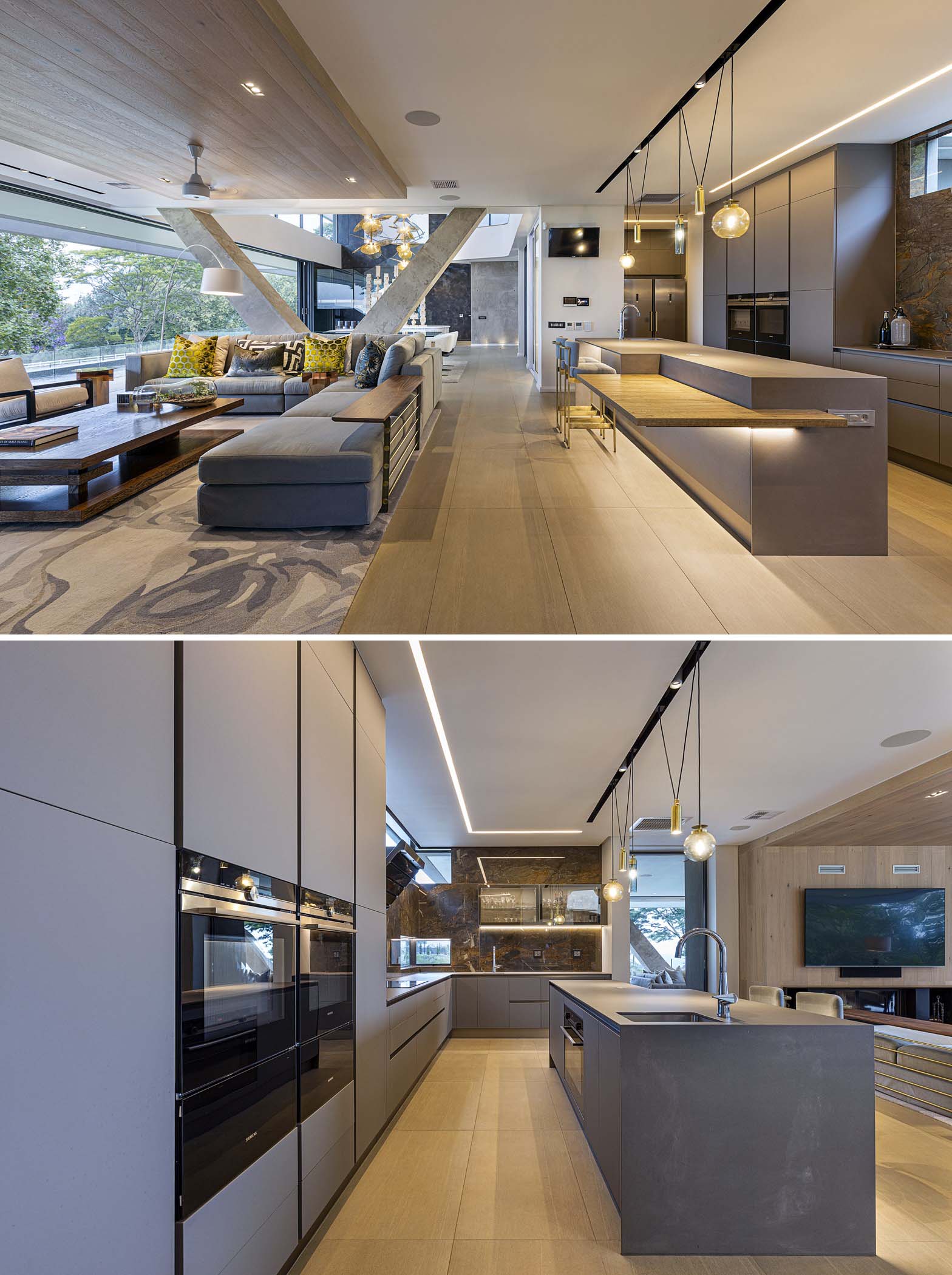 A modern kitchen with minimalist gray cabinets and an island with a wood countertop accent.