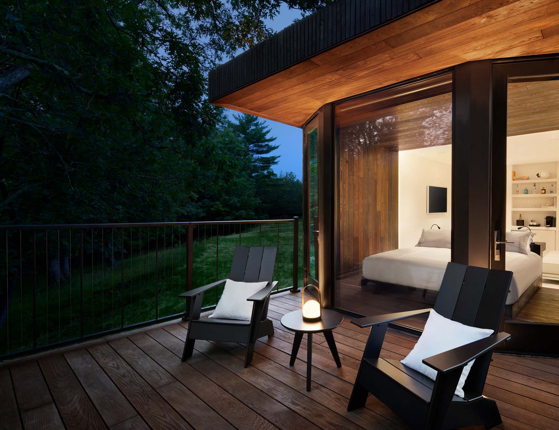 A modern hotel room with a 120 square foot outdoor deck.