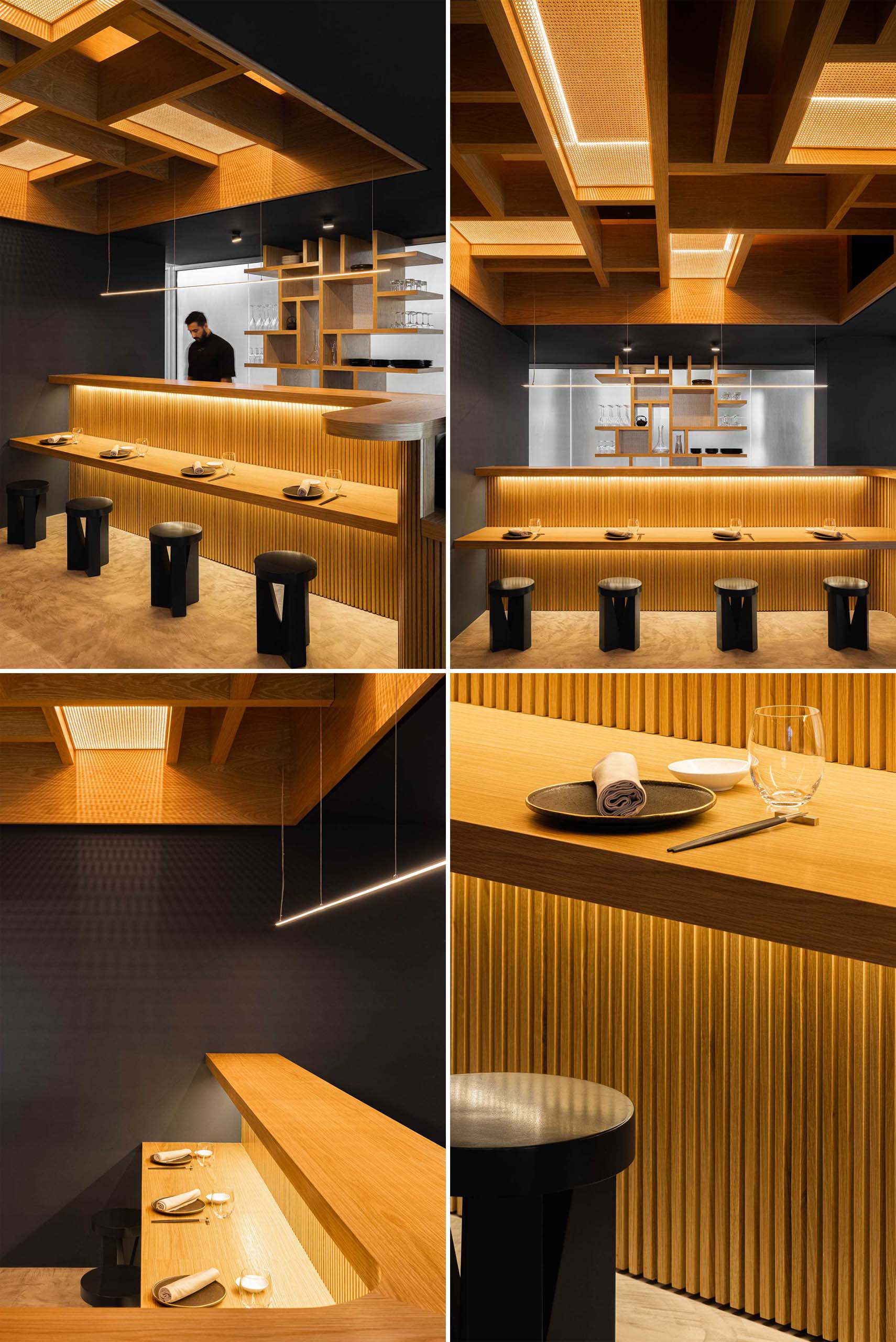A modern restaurant with dark gray walls, wood accents, straw panels, stool seating, and hidden LED lighting.