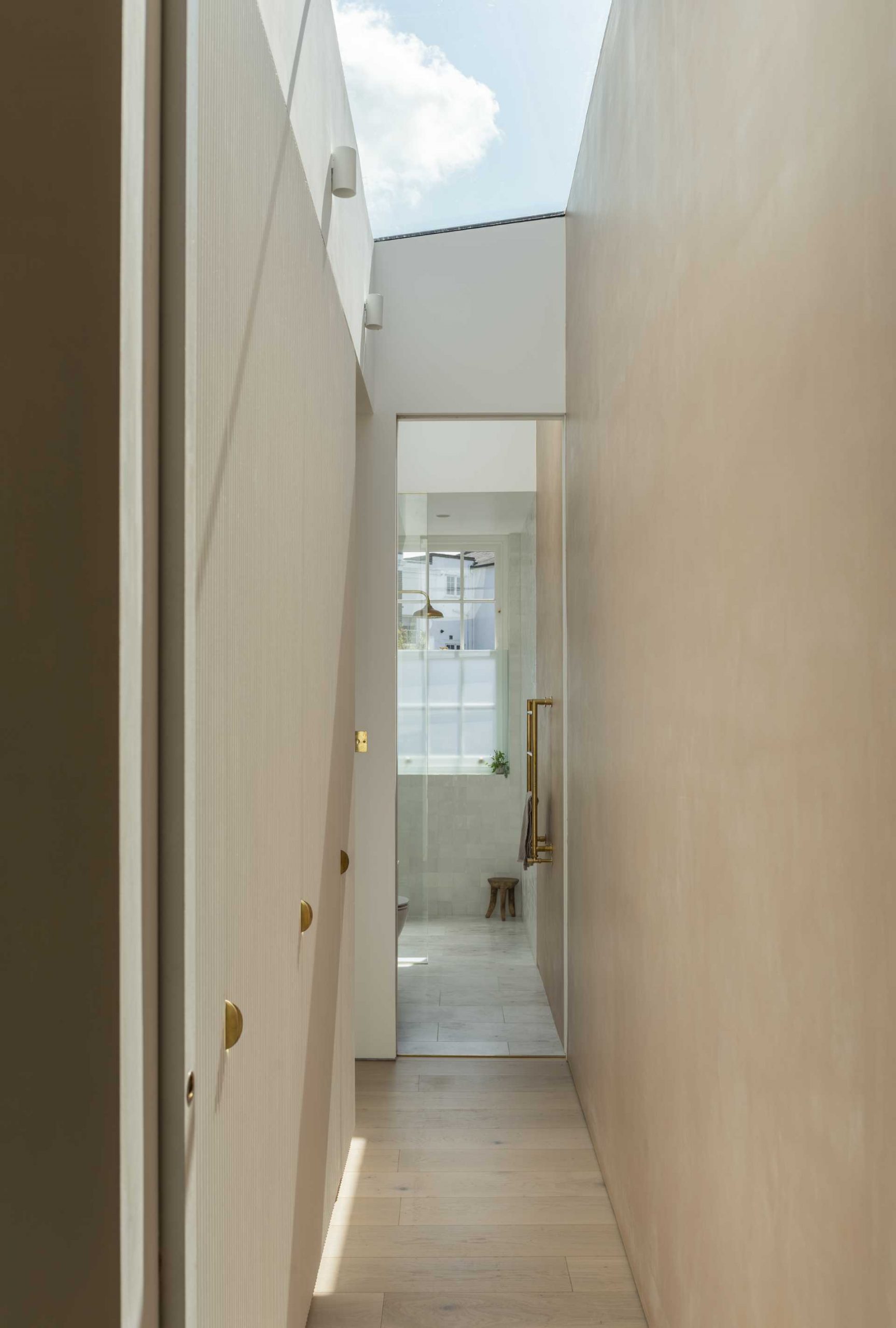 A hallway with a closet leads to the en-suite bathroom.
