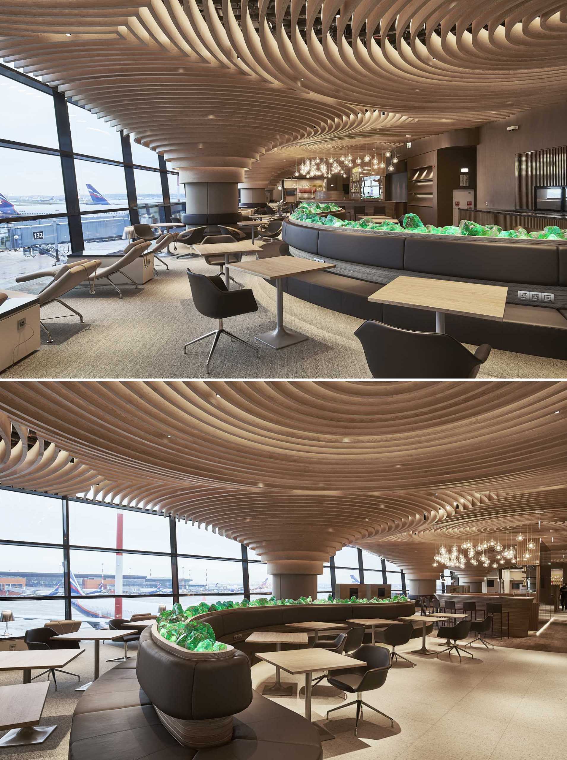 A sculptural wood ceiling covers the interior of this modern airport lounge.