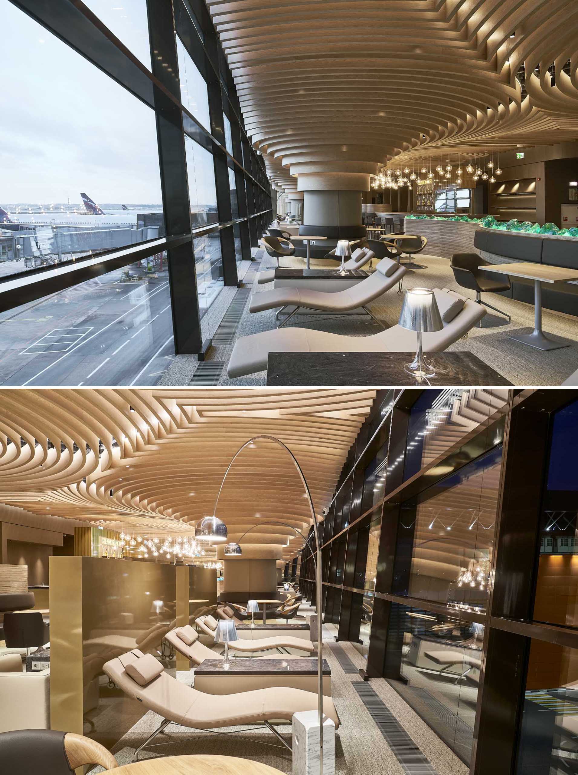 A modern airport lounge with a sculptural ceiling.