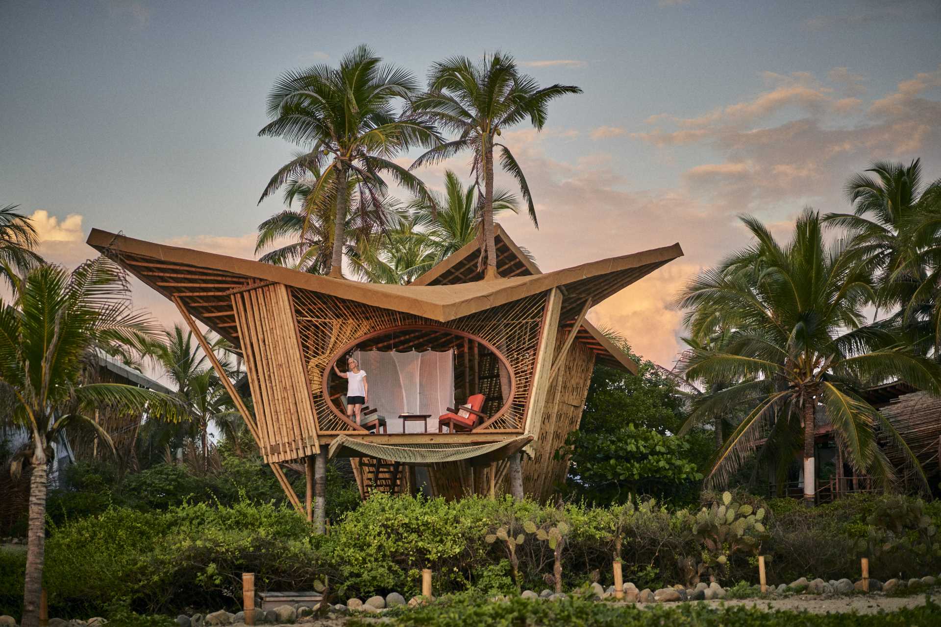 A modern bamboo treehouse inspired by the Mobula Rays that migrate past the properties shore.