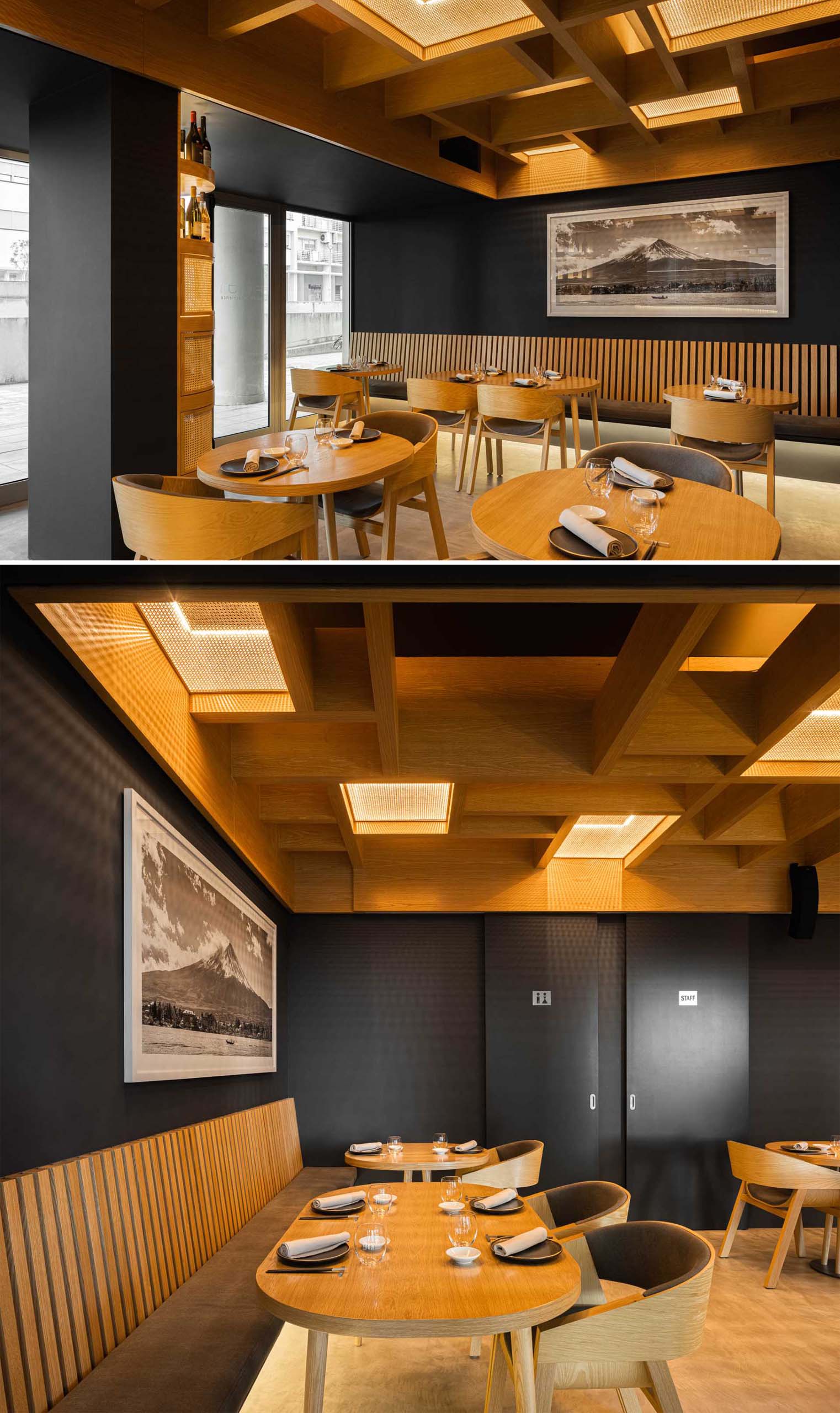 A modern restaurant interior with dark gray walls, wood accents, and hidden LED lighting.
