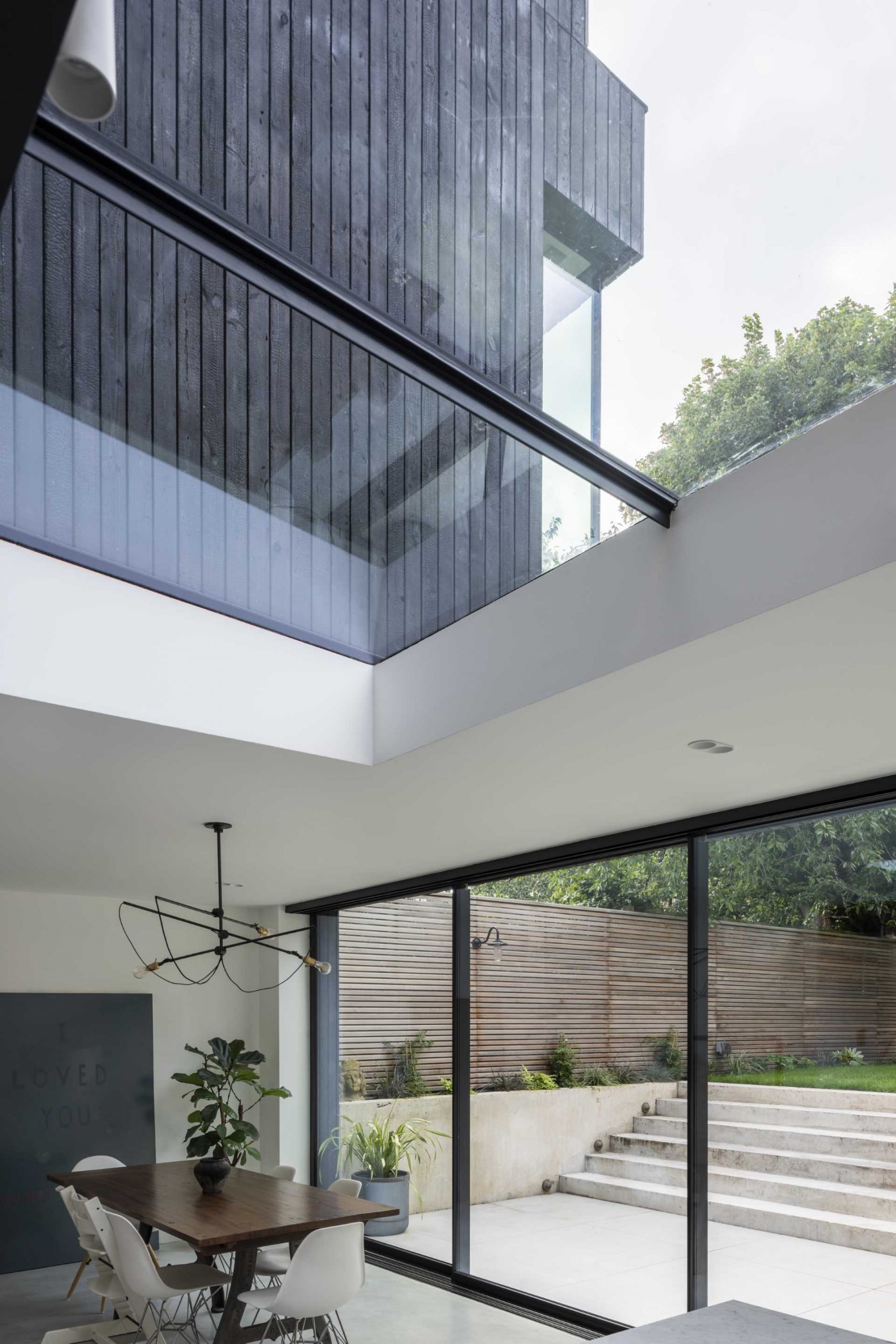 In addition to the sliding glass doors, a skylight spans the space between the dining area and the kitchen, adding an abundance of natural light to the interior.