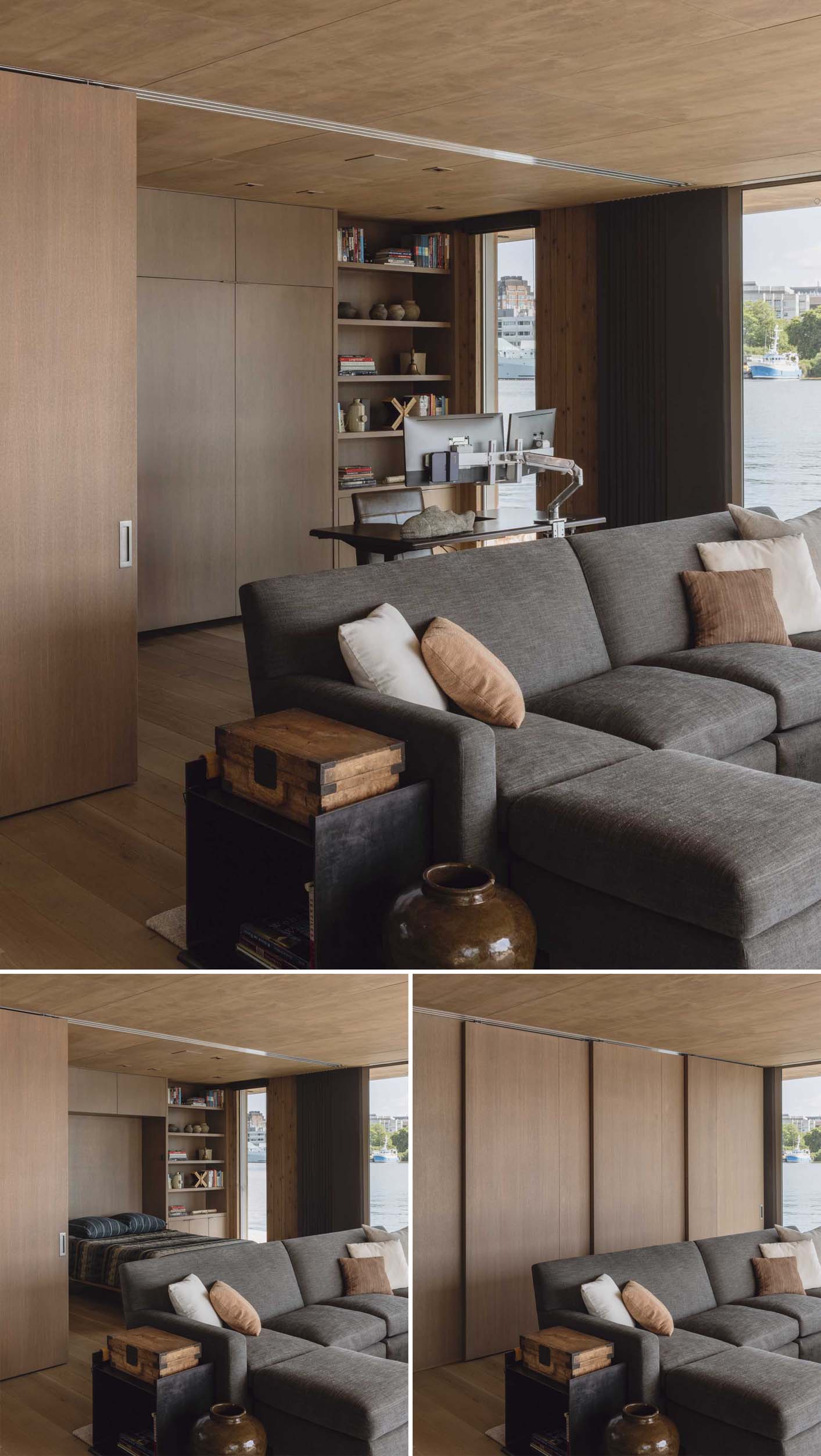 Behind the living room in this modern floathome, there's also a home office that doubles as a bedroom with a pull-down bed. Sliding wood panels can be pulled across to become a wall when needed.