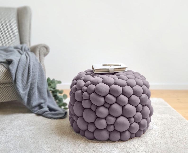 A modern ottoman with a bubble-like texture.