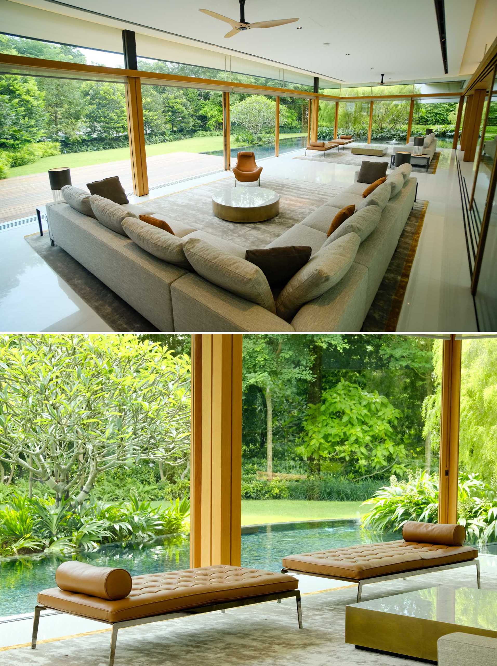 The social areas of this modern home are open to the water feature, deck, and yard, while the floor-to-ceiling windows allow natural light to flood the interior.