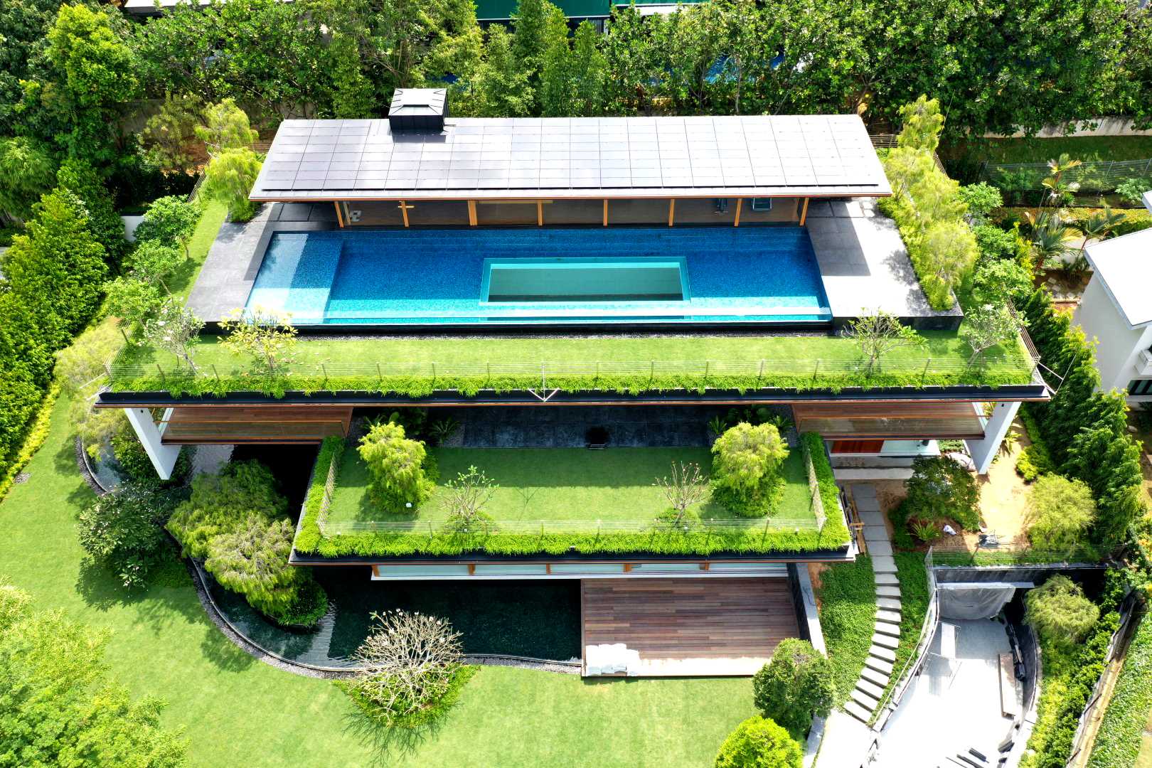 GUZ Architects has designed a new house in Singapore that has terraced roof gardens to keep the home cool.