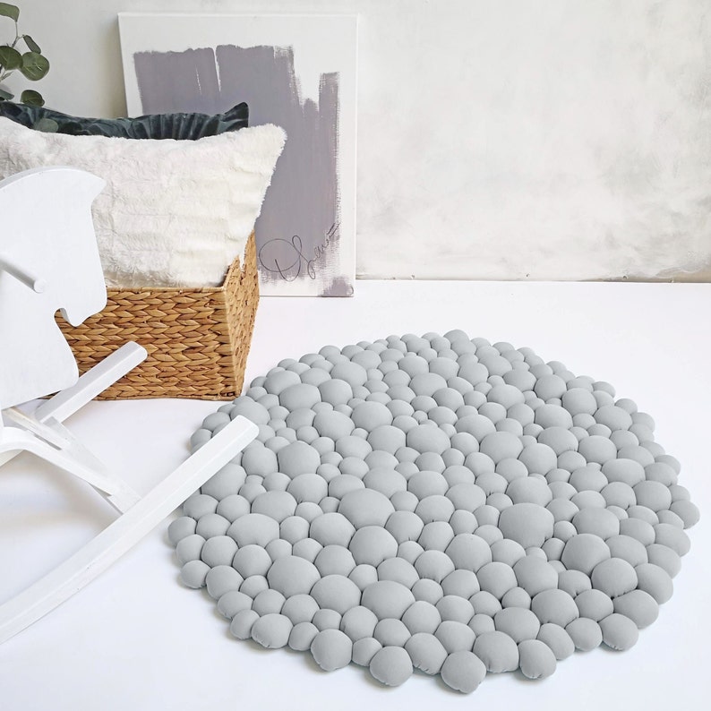A modern grey rug inspired by stones.