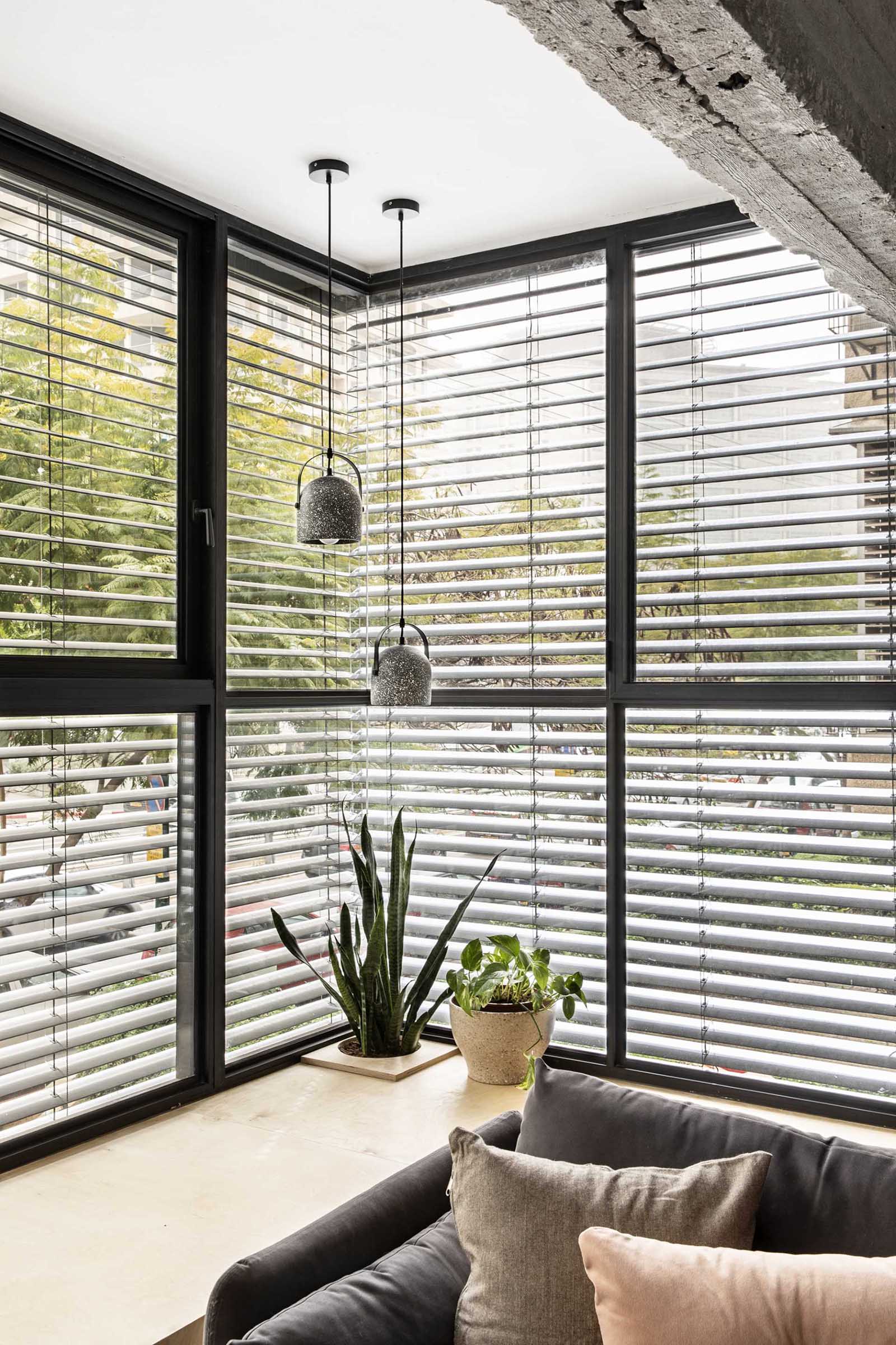 A modern living room with a large window bench.