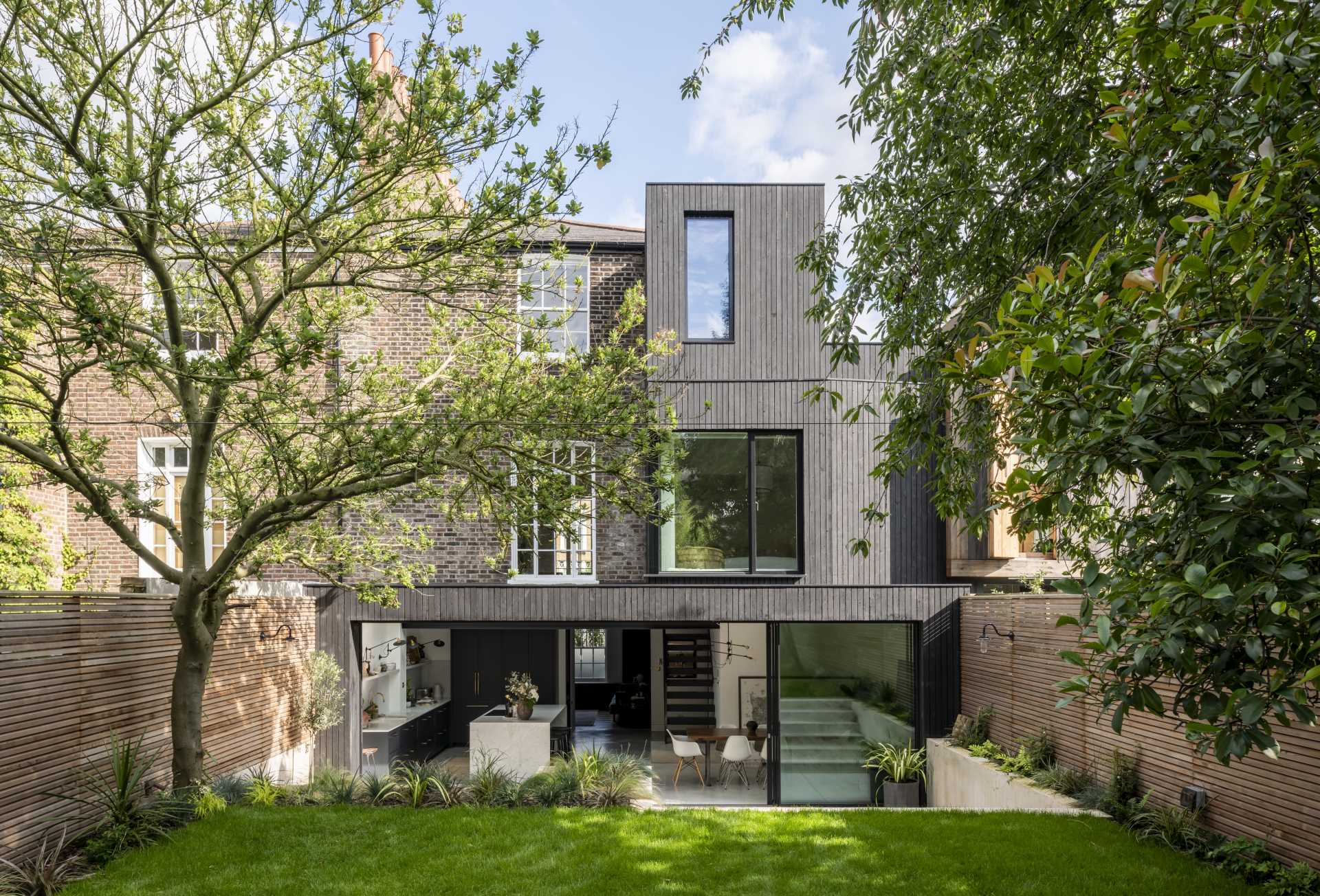 Architectural practice Paul Archer Design, has completed a full-house refurbishment and wood-clad rear extension of a semi-detached home in North London, England.