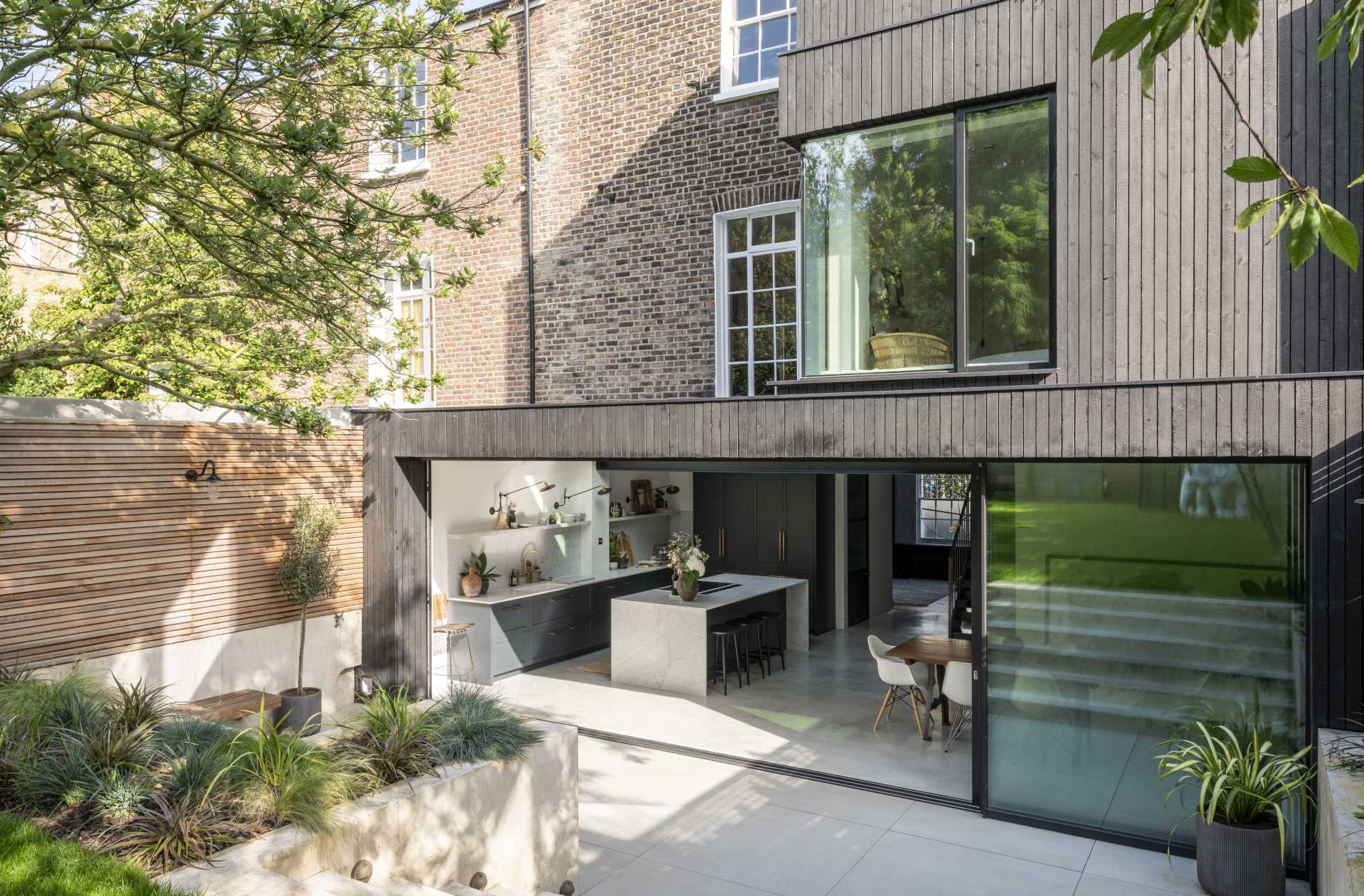 A modern wood-clad rear extension was added to a semi-detached home.