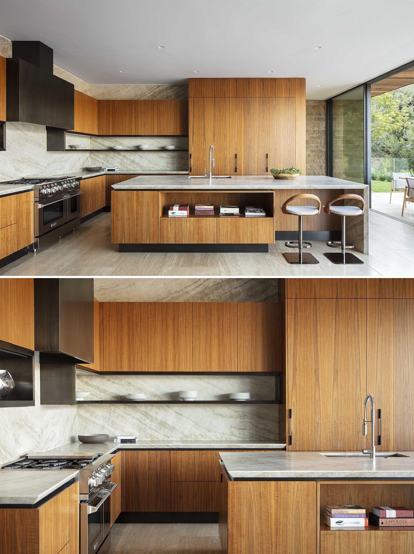 This modern kitchen has a large island with seating, minimalist wood cabinets, and some integrated appliances