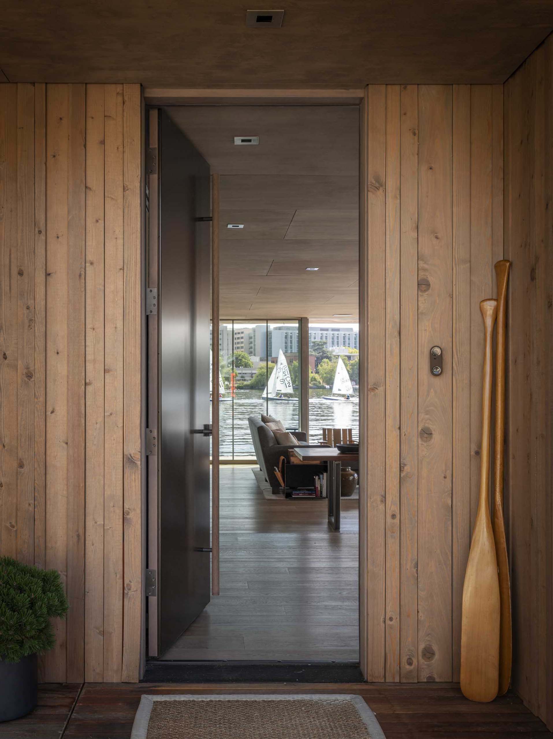 A modern floathome with warm oak flooring and casework that's balanced by cooler silver and black metals.