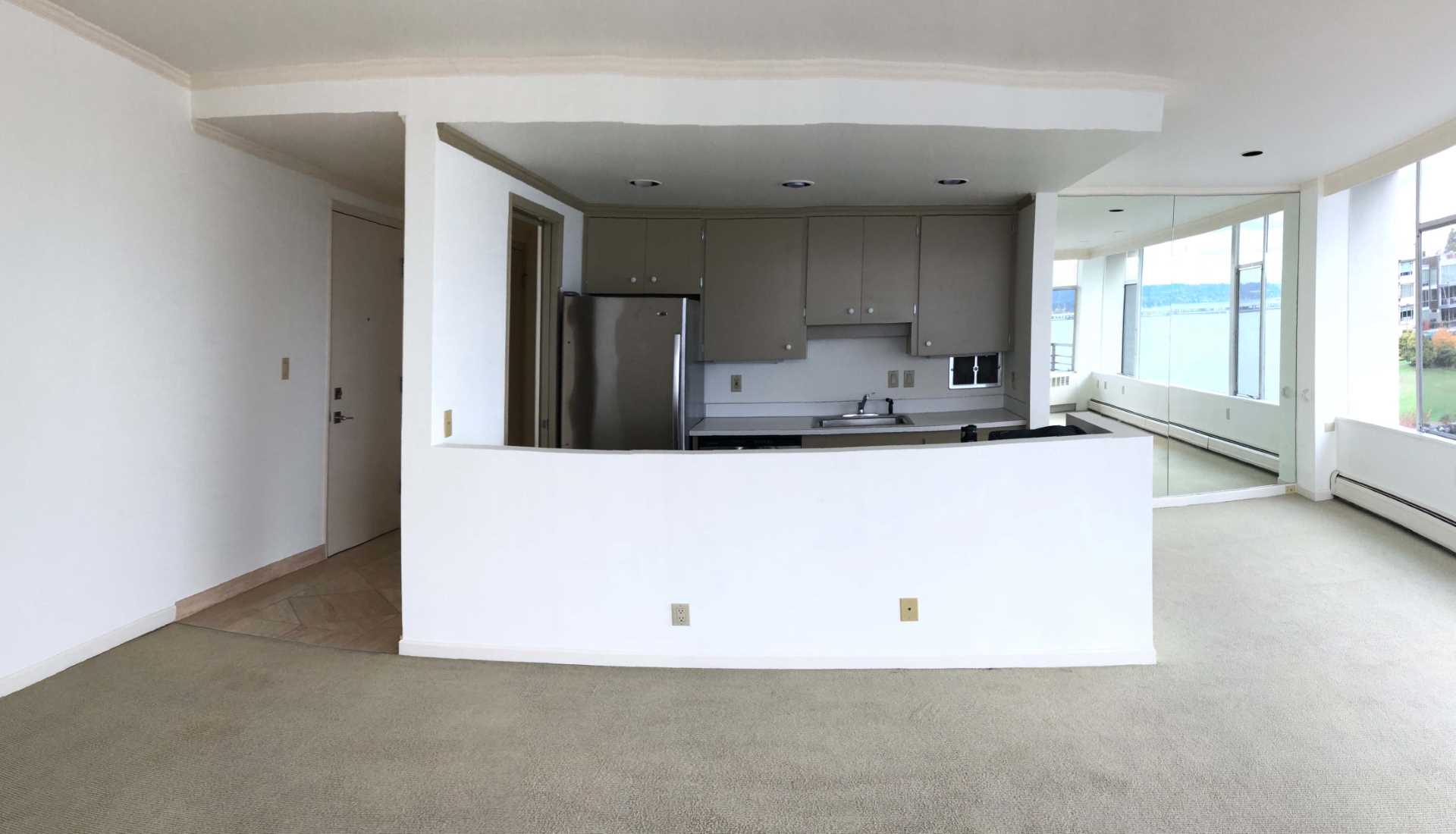 A dated mid-century modern kitchen.