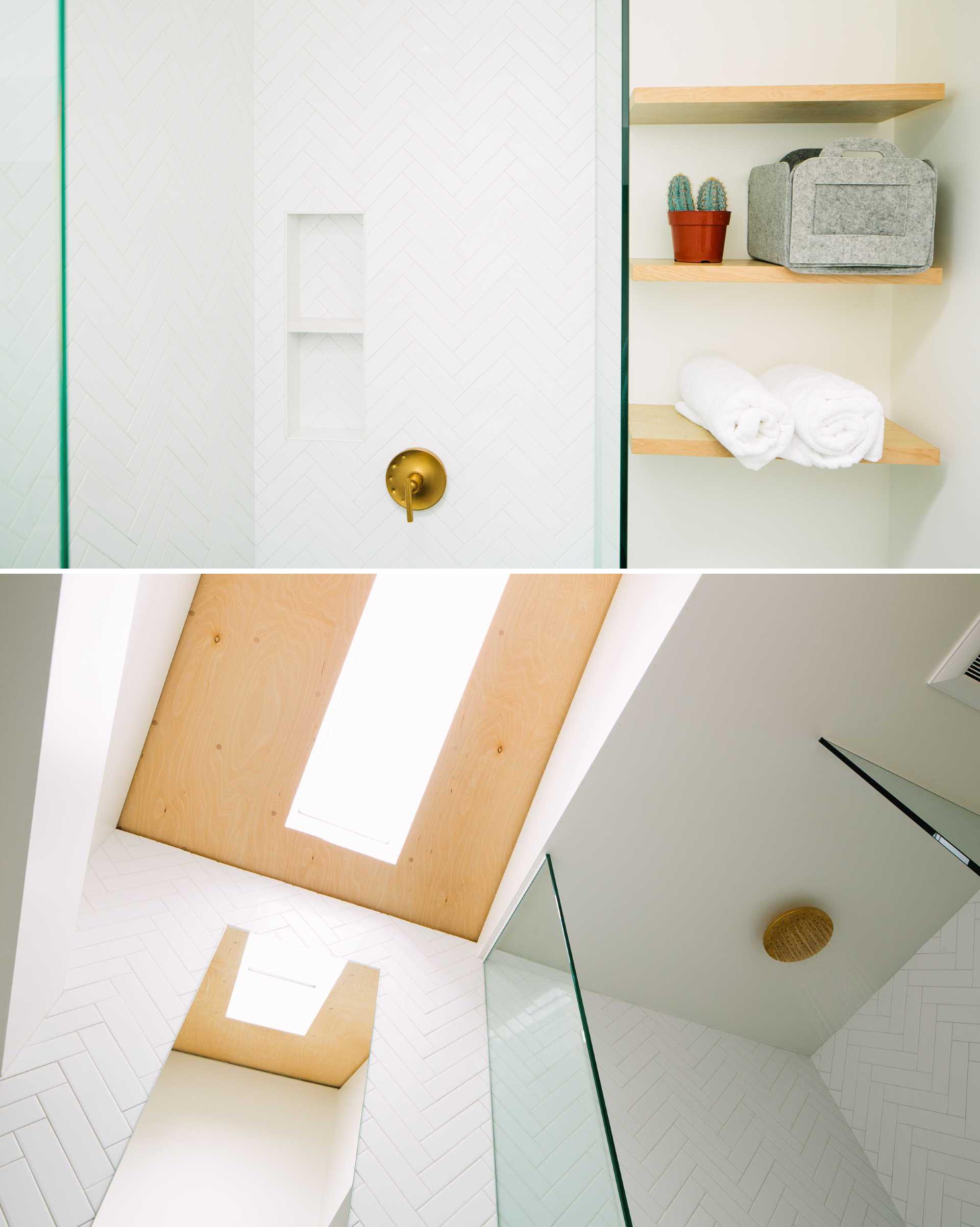 A small and modern bathroom with a herringbone tiled shower, and floating wood shelves.