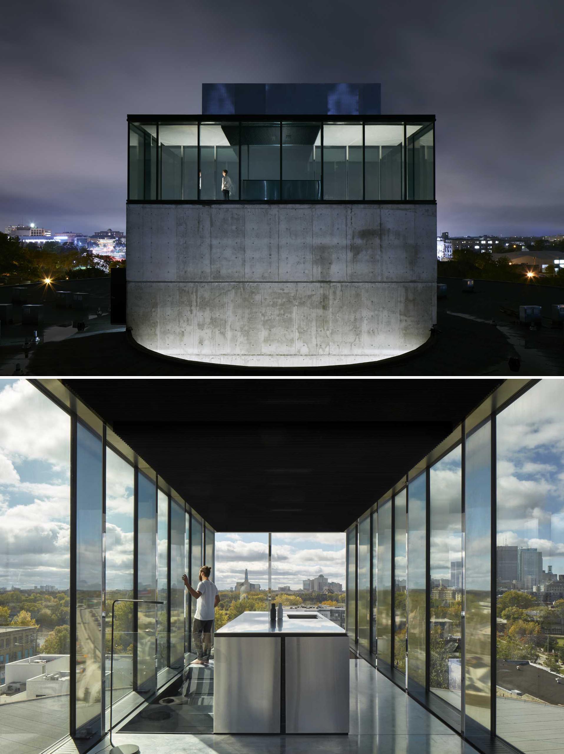 A penthouse sits on top of a concrete column and has glass walls with uninterrupted views of the city.