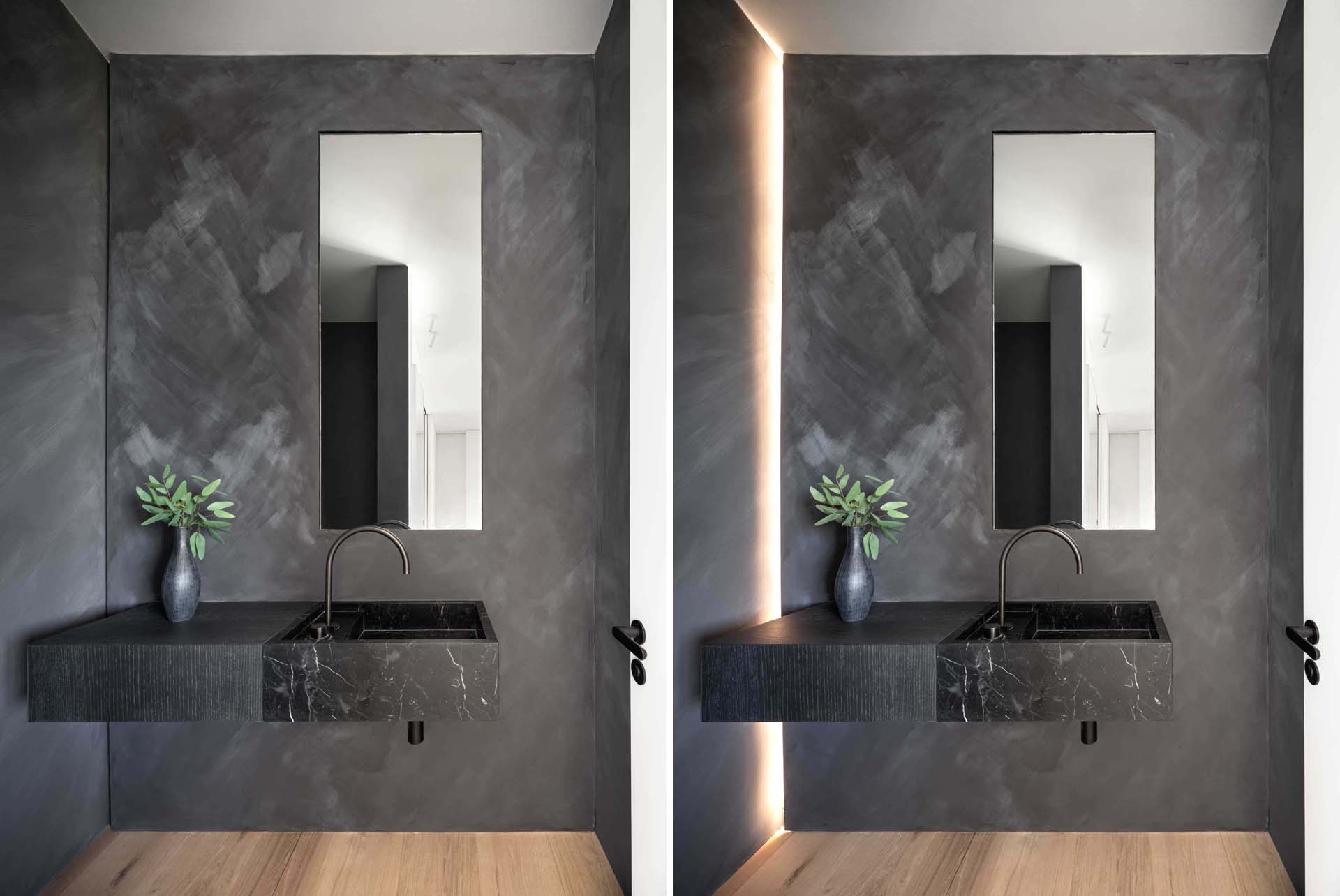 A modern bathroom with a dark accent wall and hidden lighting.