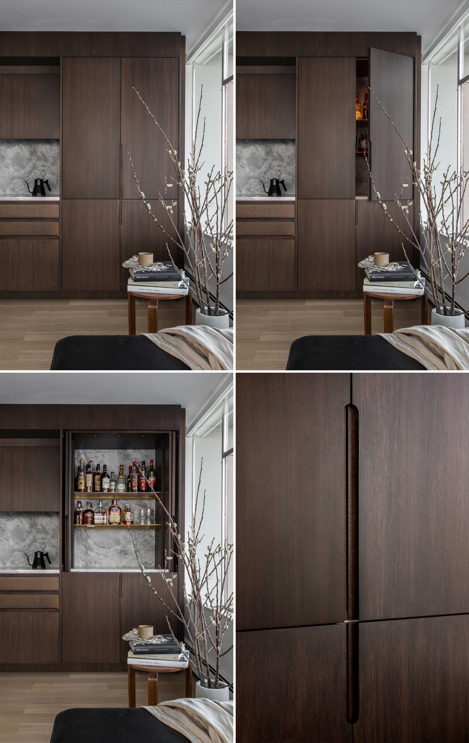 While cooking and preparing drinks, these dark wood cabinets have flip-up and nested doors that recede into niches and allow full open access to the cabinet interiors. 