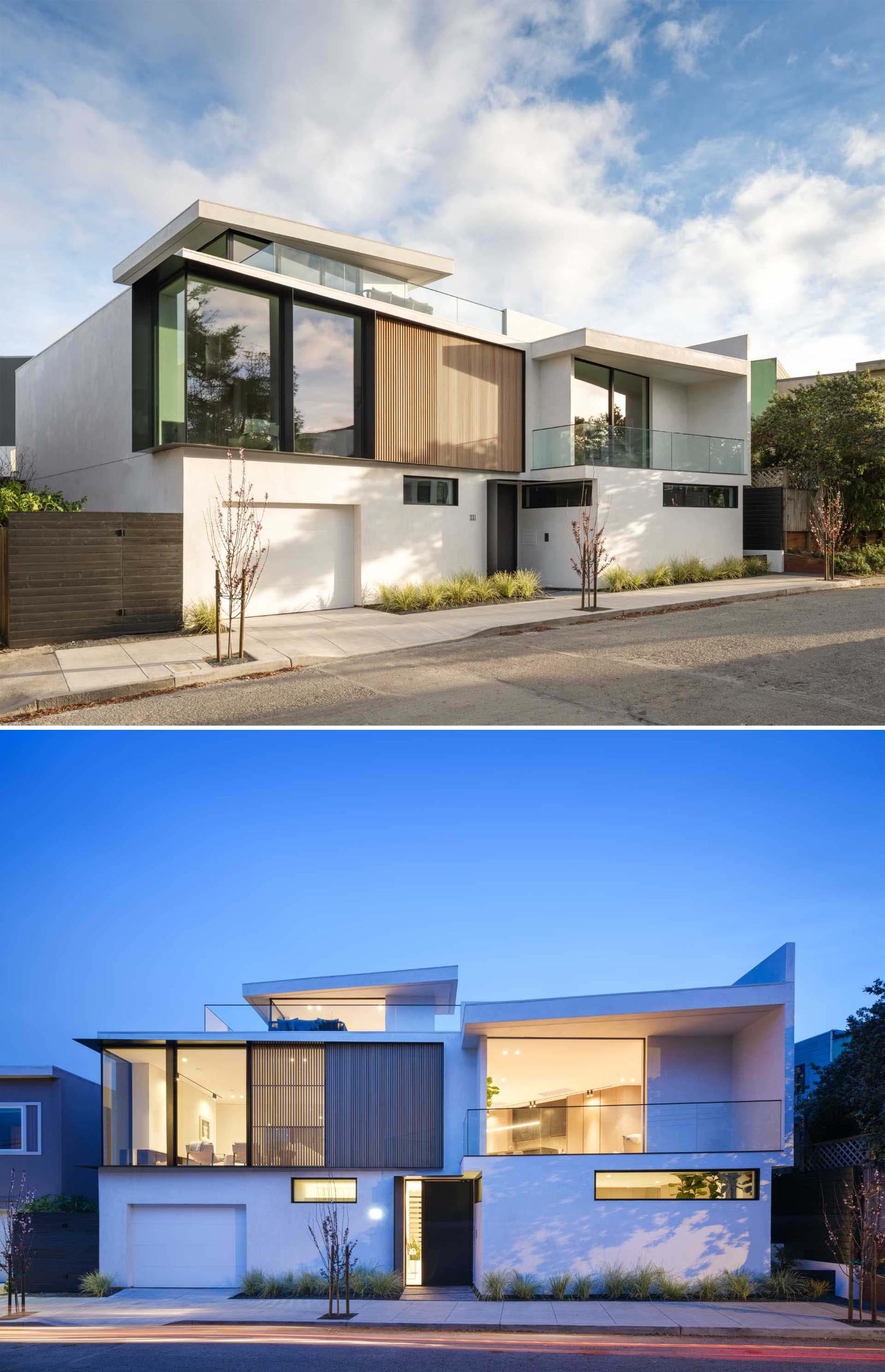 The facade of this modern home is composed of smooth trowelled white stucco, black metal accents, clear western cedar, and sections of glass.