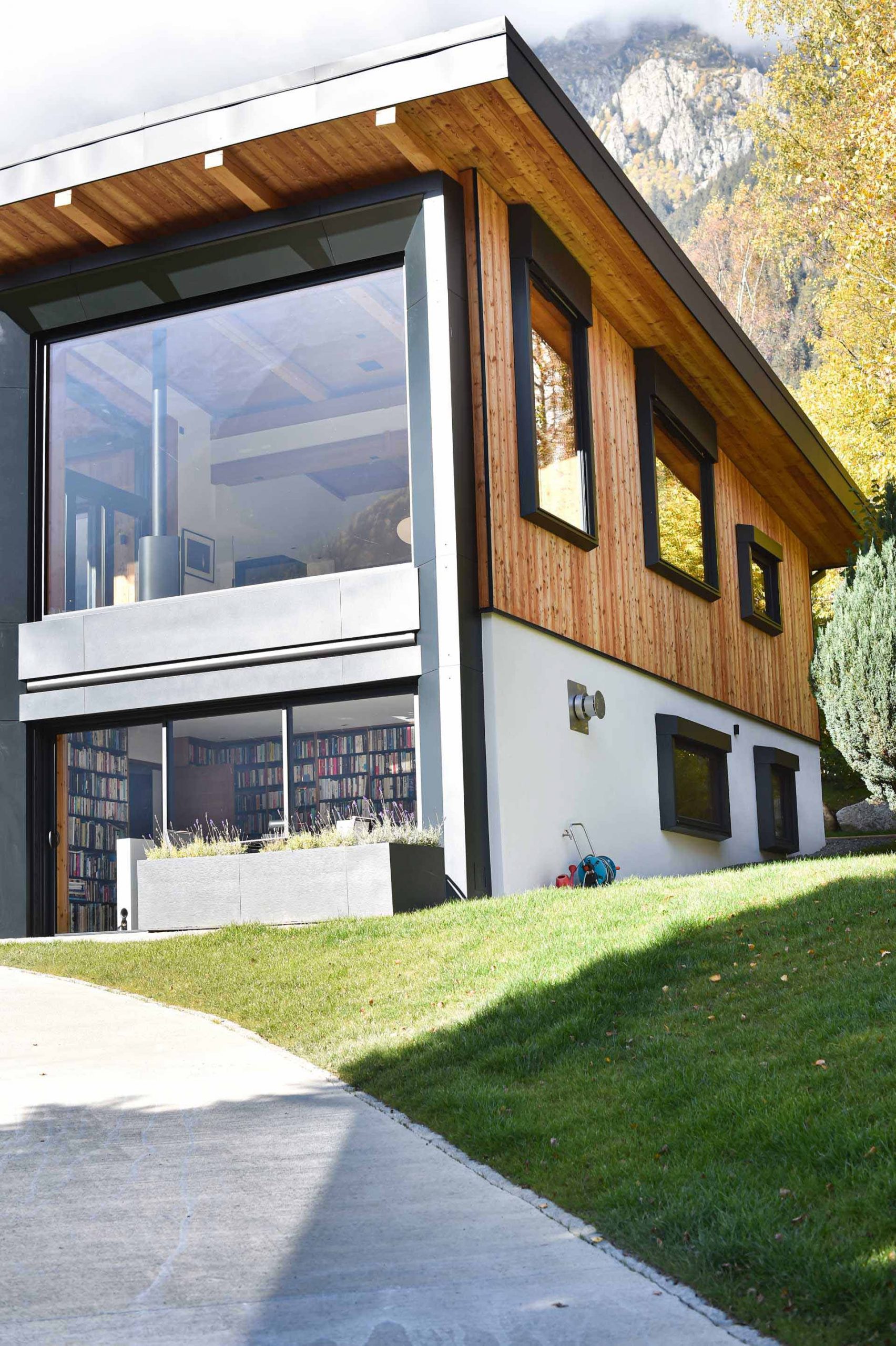 A modern house with a large picture window.