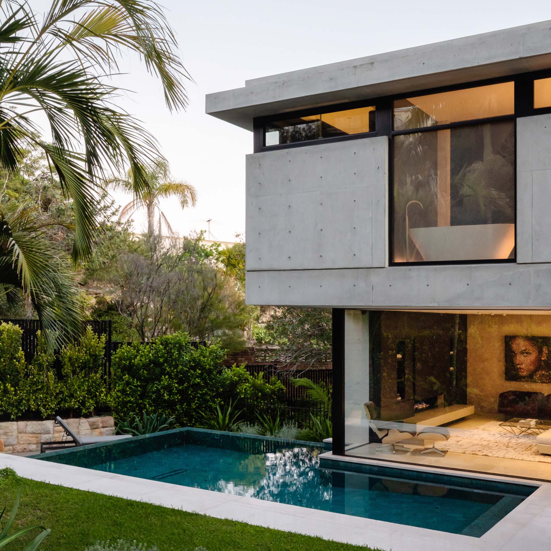 Positioned to take advantage of the sunlight and privacy, this modern swimming pool is located to one side of the rear garden along the living room glazing.