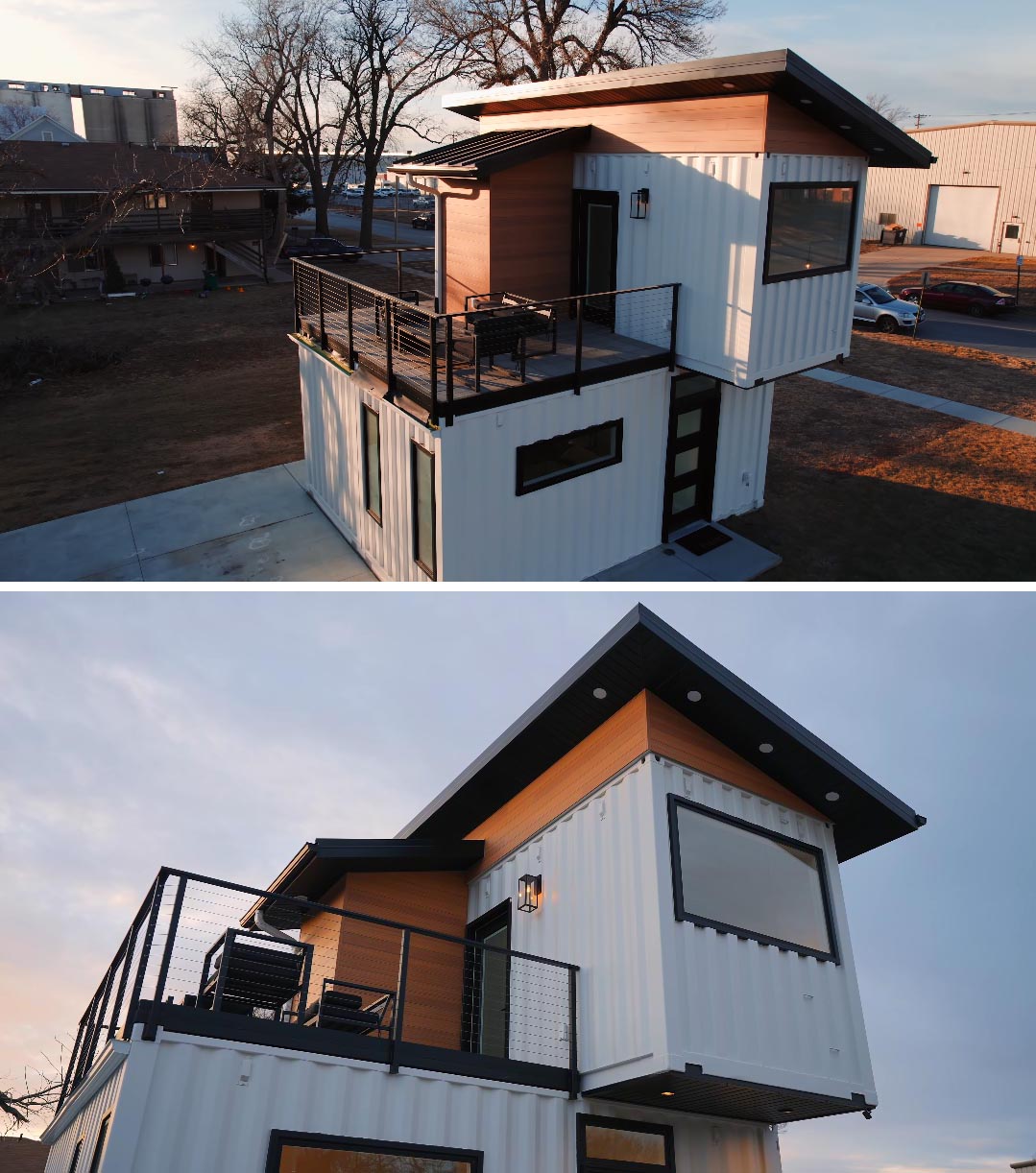This tiny house made from shipping containers, has a sloped roof, and a white exterior that's accented by wood and black frames, giving it a modern yet welcoming appearance.