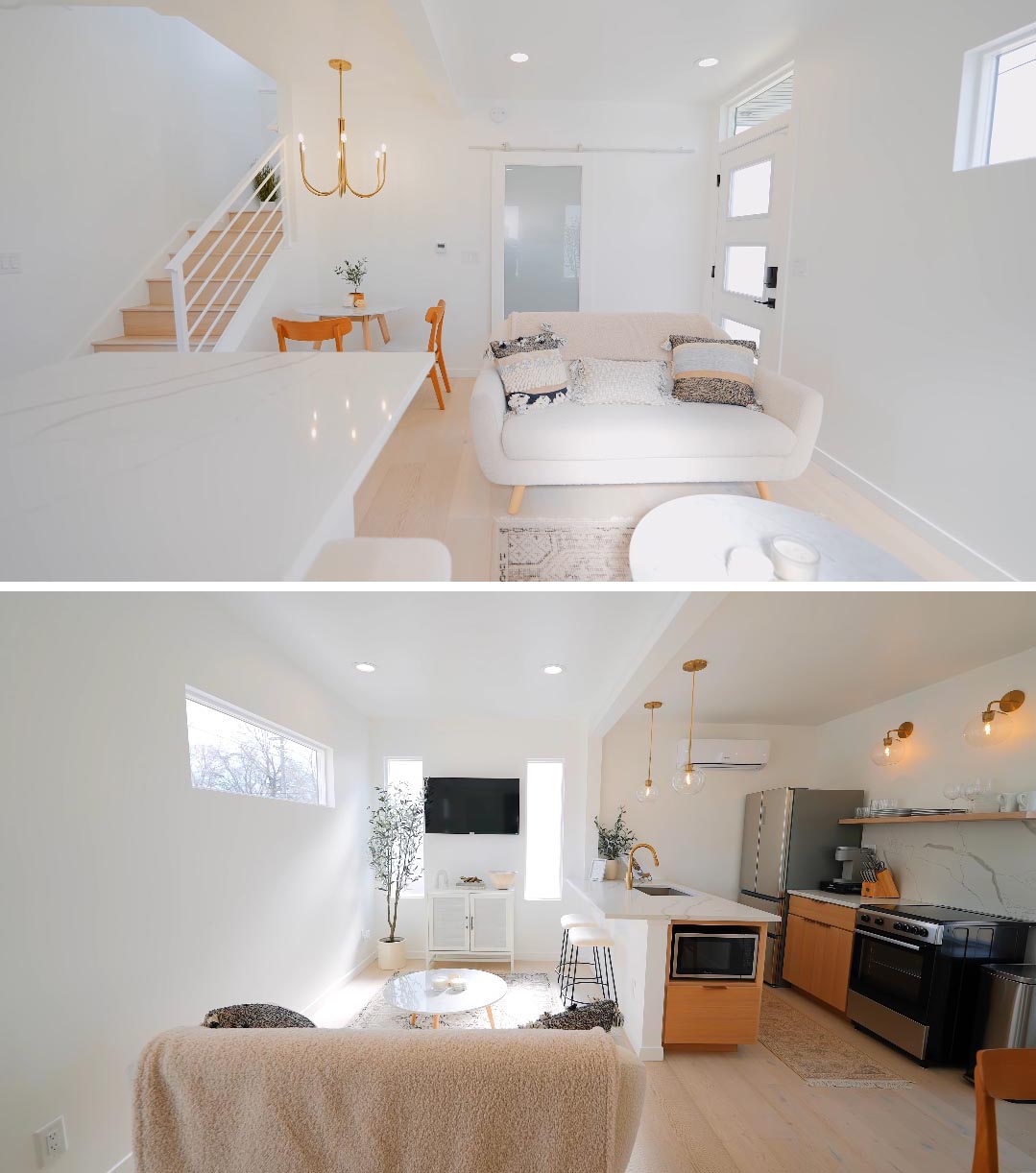 The interior of a modern tiny house made from shipping containers, is bright white with gold accents.