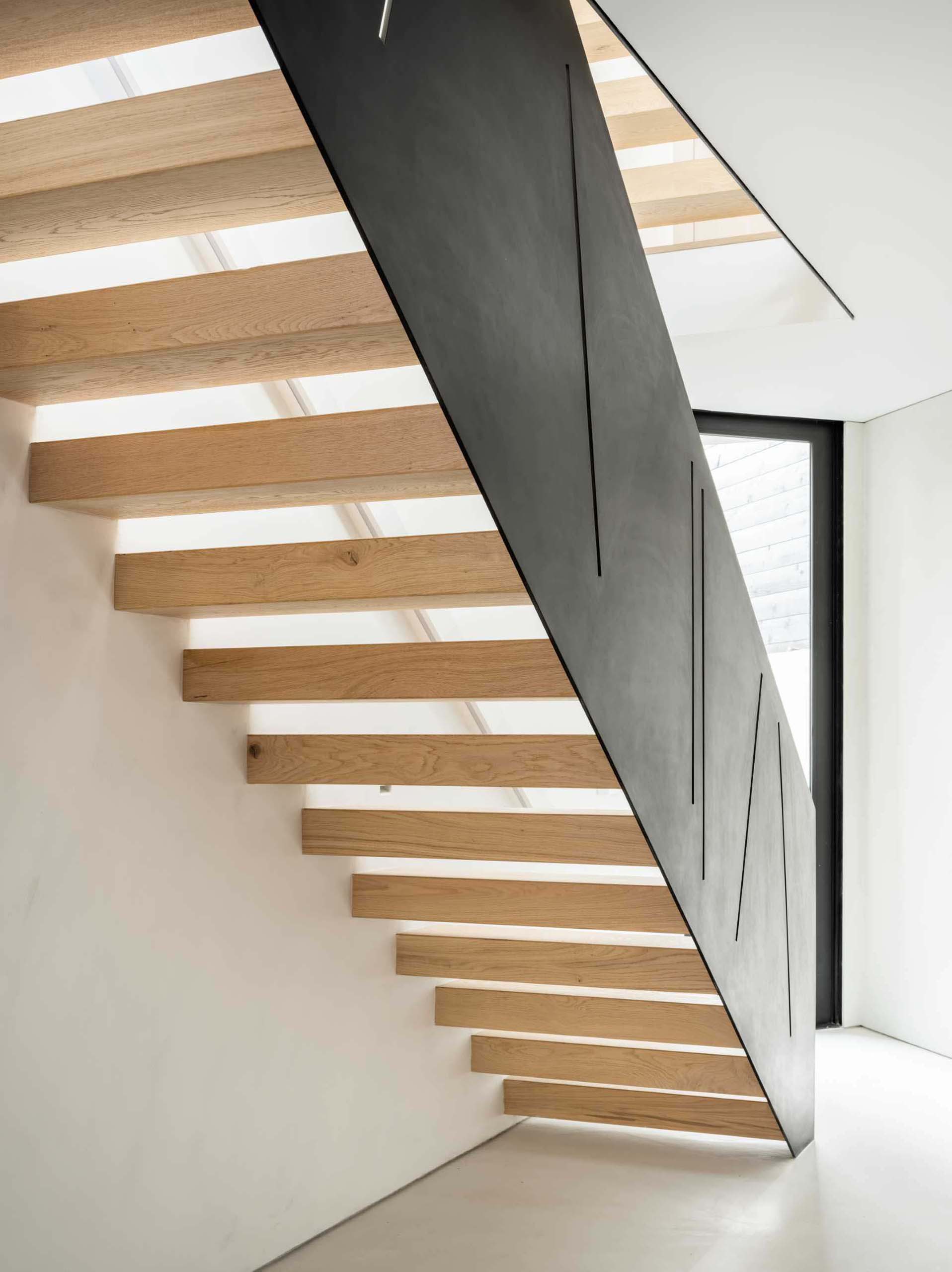 A modern home with steel and wood stairs.