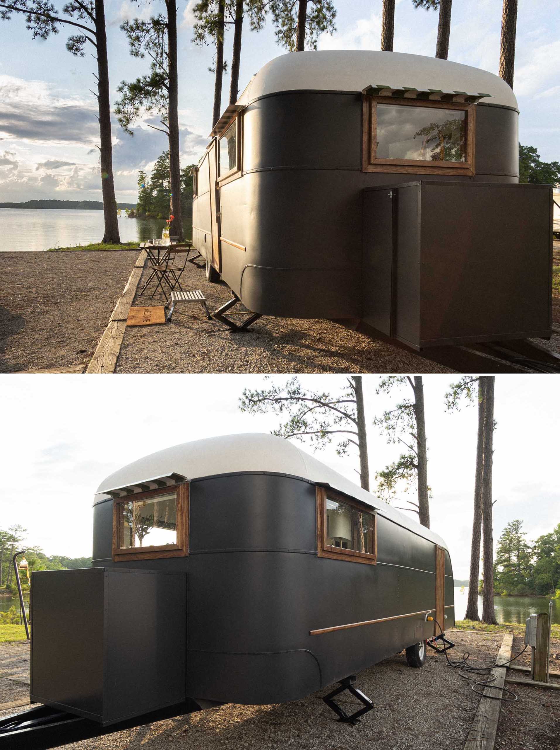 This remodeled vintage 1948 Vagabond 23 travel trailer includes matte black and white exterior with wood accents.
