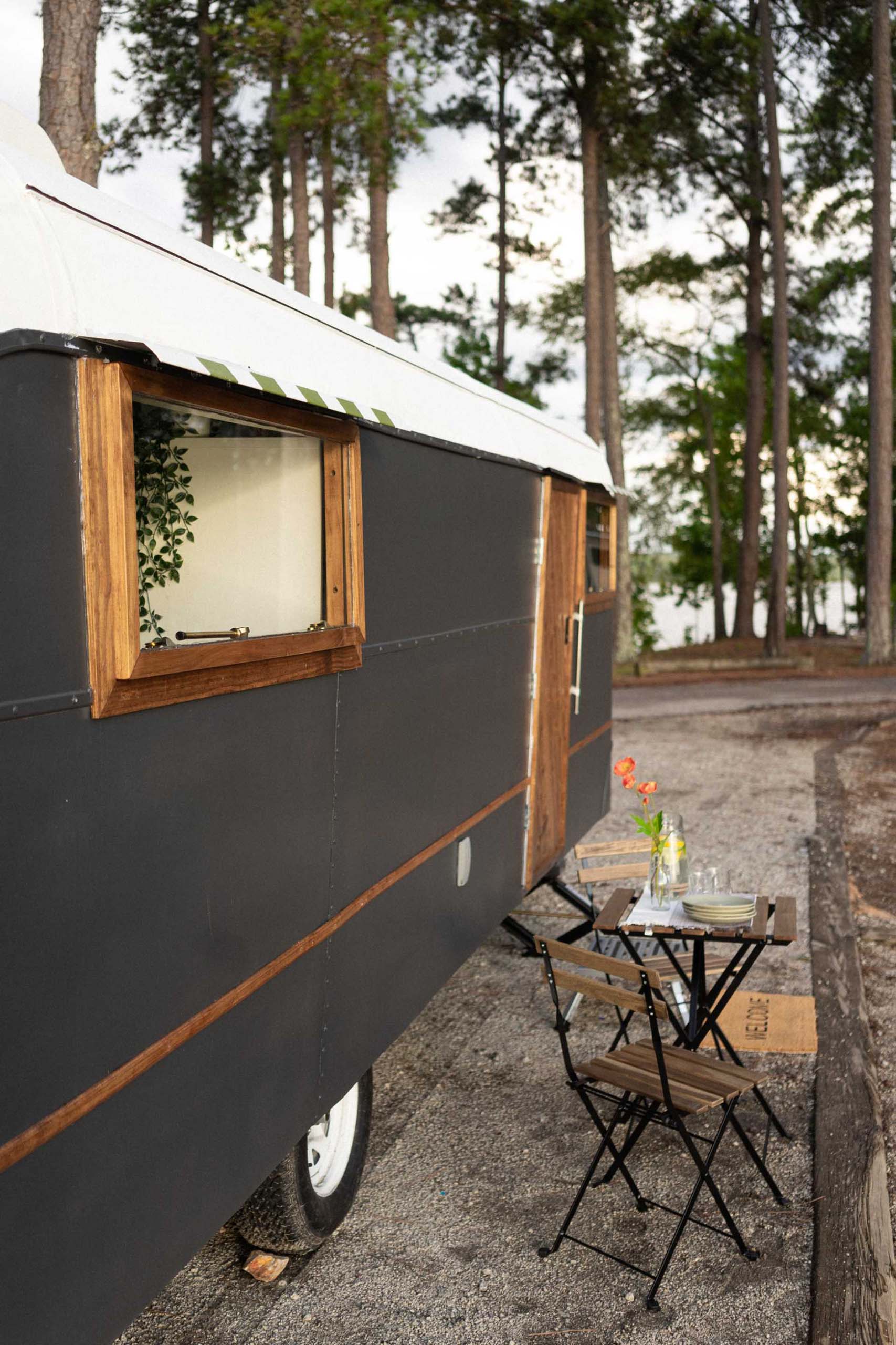 A remodeled vintage 1948 Vagabond 23 travel trailer includes has a matte black and white exterior and a modern interior.